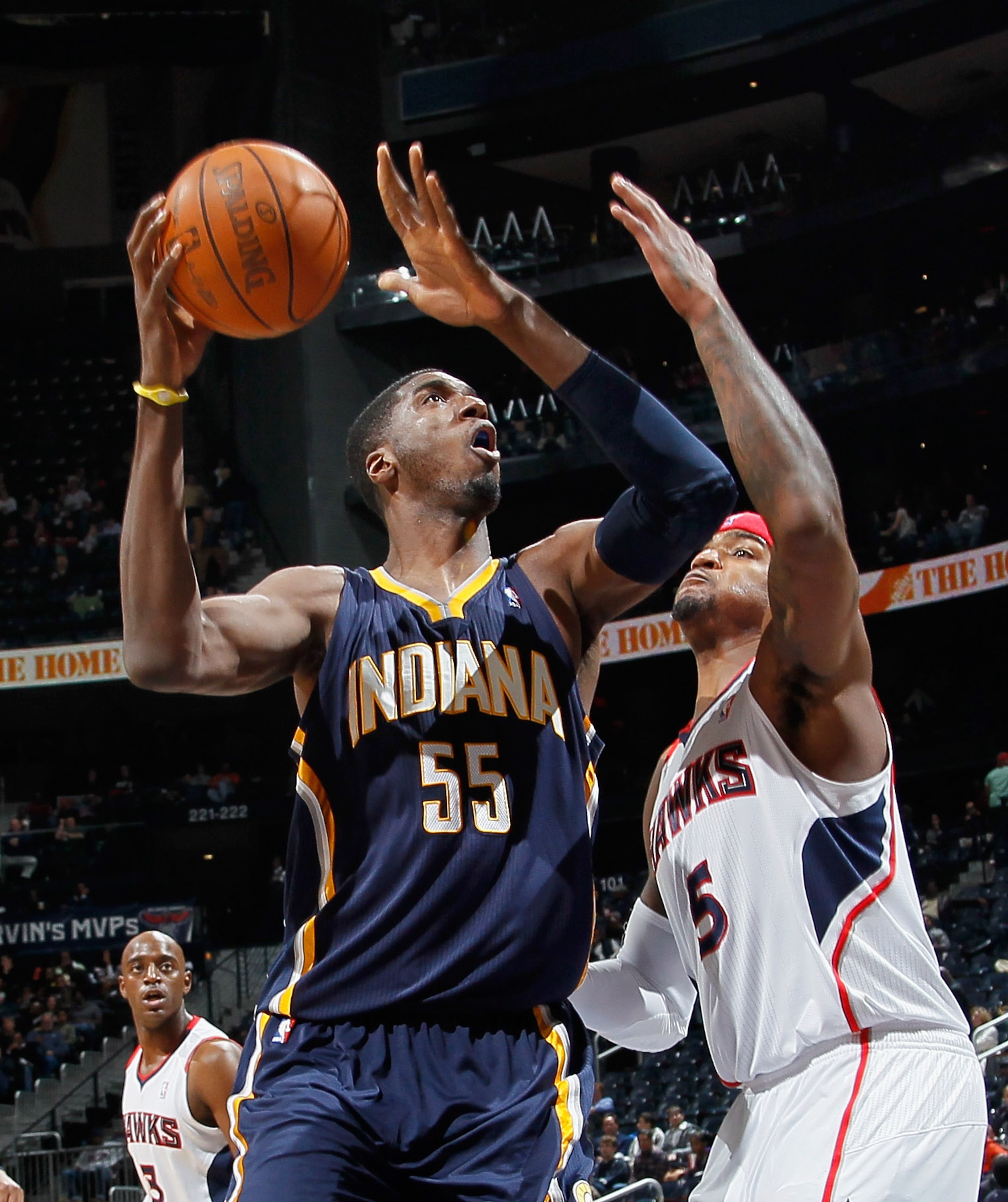 ATLANTA, GA - DECEMBER 11:  Roy Hibbert #55 of the Indiana Pacers drives against Josh Smith #5 of the Atlanta Hawks at Philips Arena on December 11, 2010 in Atlanta, Georgia.  NOTE TO USER: User expressly acknowledges and agrees that, by downloading and/o