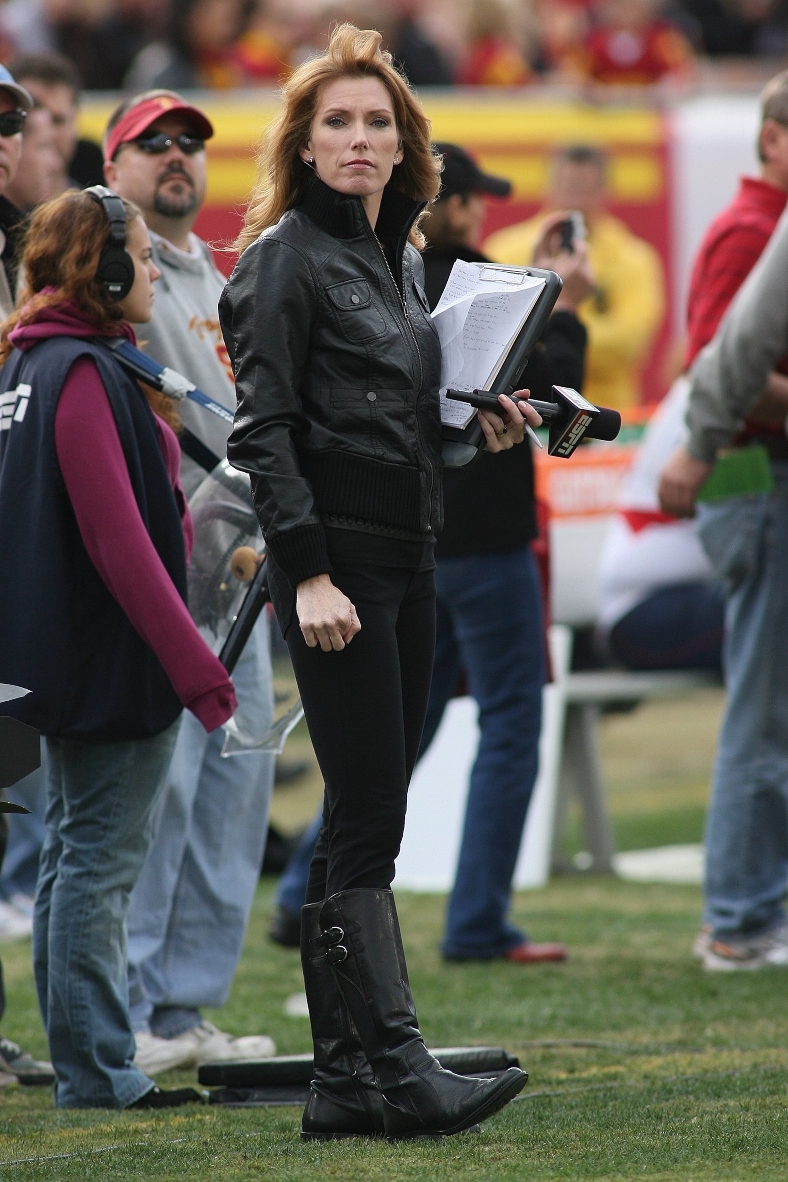 LOS ANGELES, CA - DECEMBER 5:  ESPN sideline reporter Heather Cox watches the play during the game between the Arizona Wildcats and the USC Trojans on December 5, 2009 at the Los Angeles Coliseum in Los Angeles, California.  Arizona won 21-17.  (Photo by