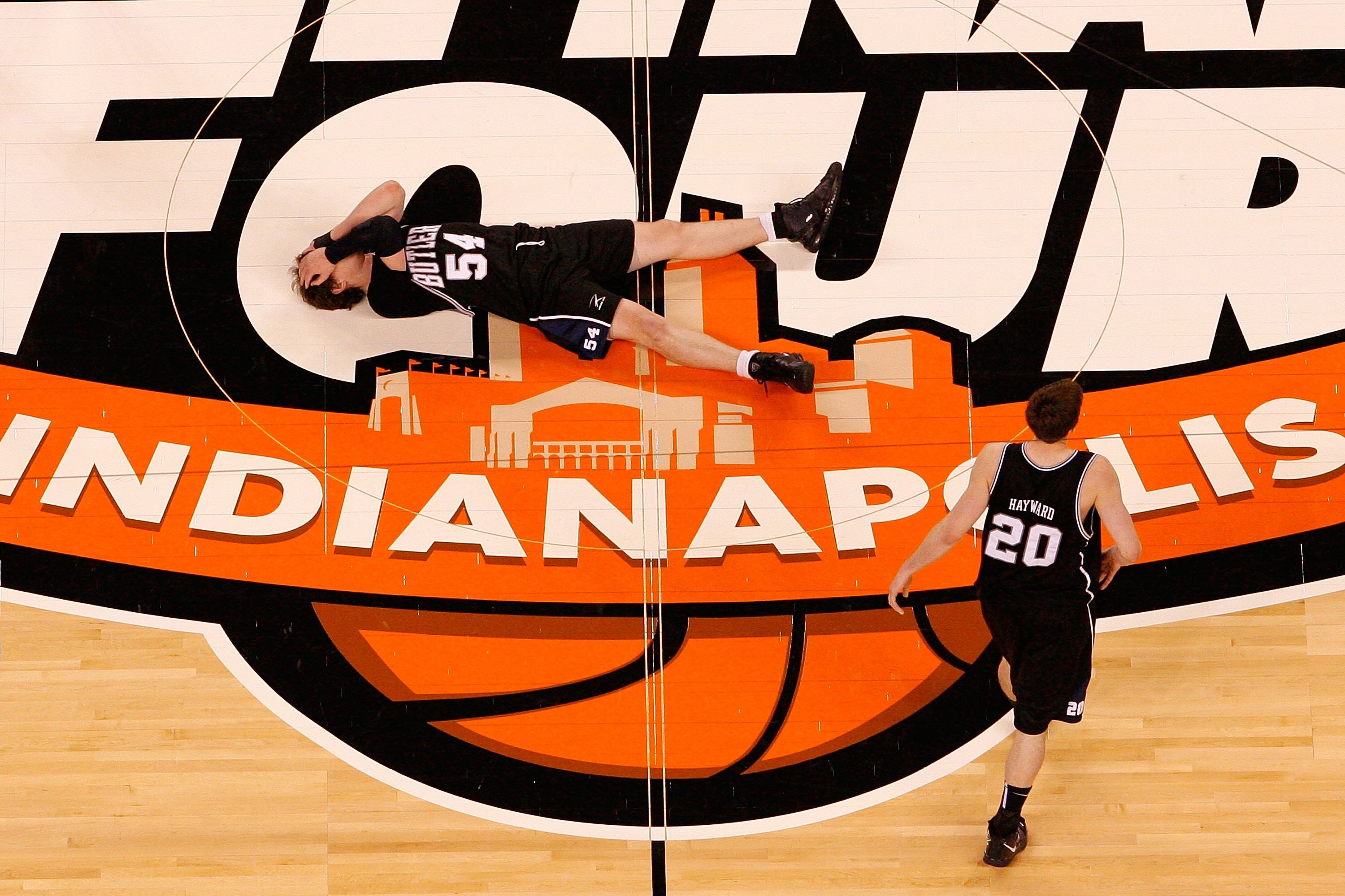 INDIANAPOLIS - APRIL 05:  Matt Howard #54 and Gordon Hayward #20 of the Butler Bulldogs remain on the court dejected after they lost 61-59 against the Duke Blue Devils during the 2010 NCAA Division I Men's Basketball National Championship game at Lucas Oi