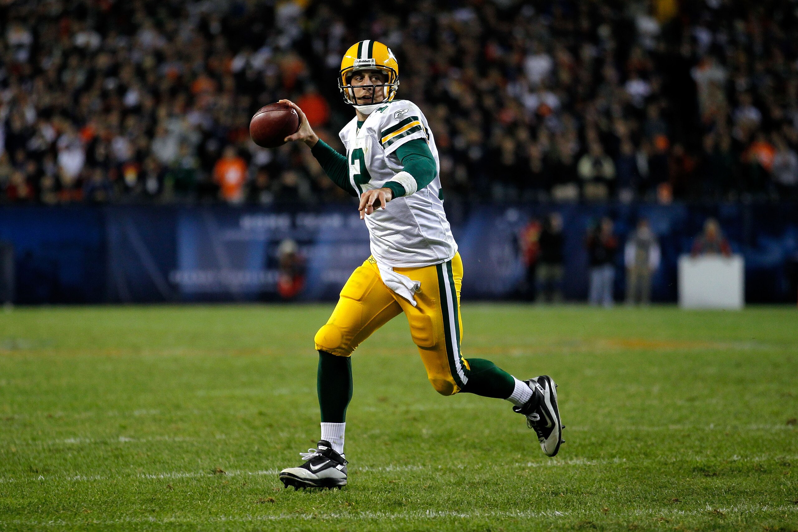 CHICAGO - SEPTEMBER 27: Quarterback Aaron Rodgers #12 of the Green Bay Packers rolls out to pass against the Chicago Bears at Soldier Field on September 27, 2010 in Chicago, Illinois. (Photo by Jonathan Daniel/Getty Images) CHICAGO - SEPTEMBER 27: Quarterback Aaron Rodgers #12 of the Green Bay Packers rolls out to pass against the Chicago Bears at Soldier Field on September 27, 2010 in Chicago, Illinois. (Photo by Jonathan Daniel/Getty Images)