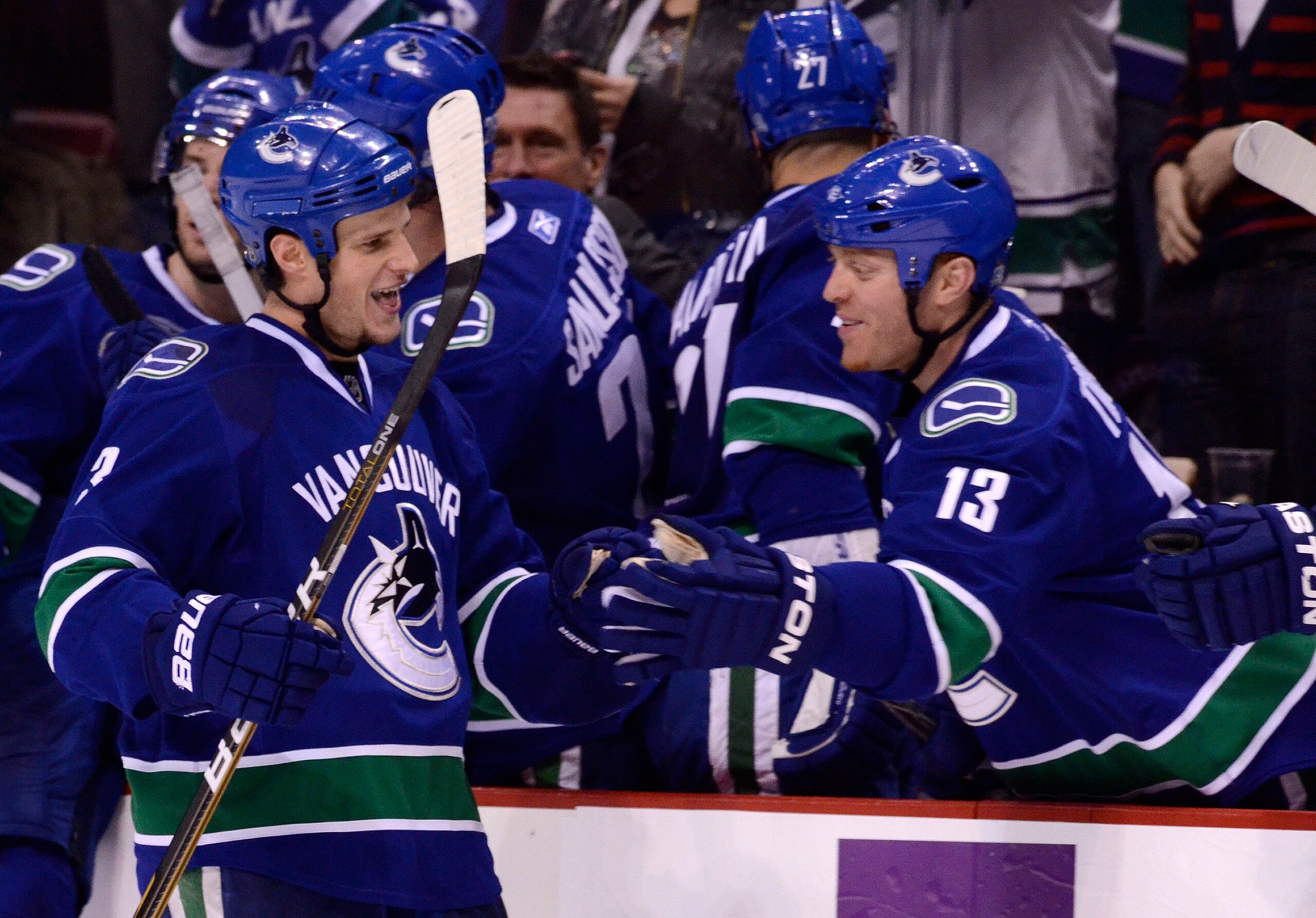 VANCOUVER, CANADA - DECEMBER 26: Kevin Bieksa #3 of the Vancouver Canucks is congratulated by Raffi Torres #13 after scoring what proved to be the game winning goal in a 3-2 win against the Edmonton Oilers during the third period in NHL action on December