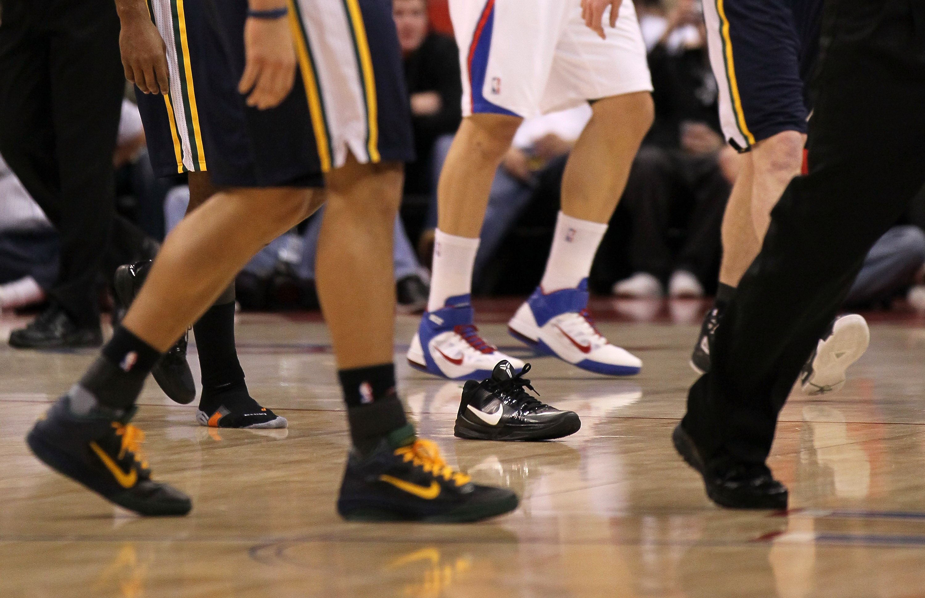 LOS ANGELES, CA - DECEMBER 29: Players walk past a loose shoe on the court during the game between the Utah Jazz and the Los Angeles Clippers at Staples Center on December 29, 2010 in Los Angeles, California.    NOTE TO USER: User expressly acknowledges a
