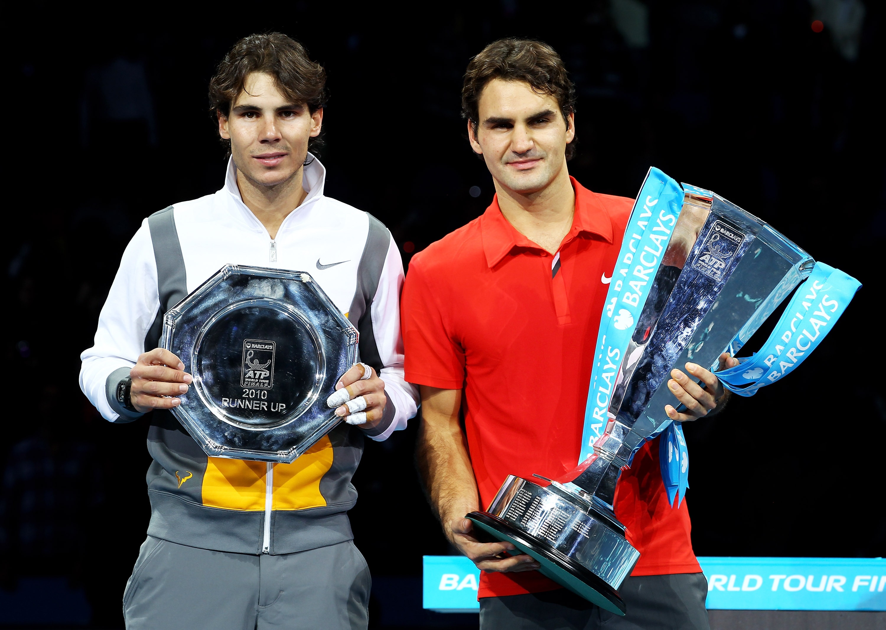 LONDON, ENGLAND - NOVEMBER 28:  Roger Federer (R) of Switzerland poses with the winners trophy and Rafael Nadal of Spain after their men's final match during the ATP World Tour Finals at O2 Arena on November 28, 2010 in London, England.  (Photo by Julian 