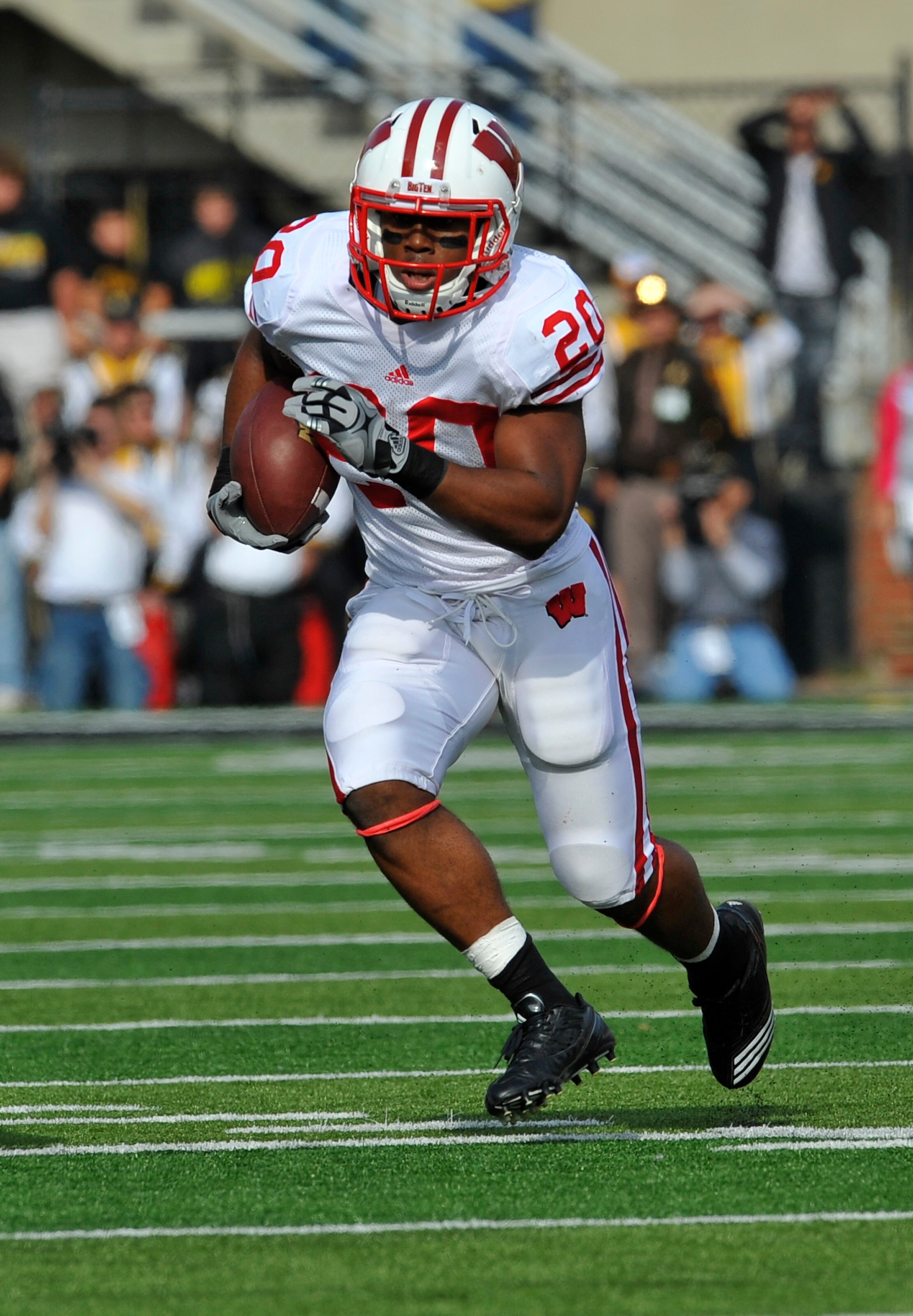 IOWA CITY, IA - OCTOBER 23- Running back James White #20 of the Wisconsin Badgers drives the ball down field against the University of Iowa Hawkeyes during the first half of play at Kinnick Stadium on October 23, 2010 in Iowa City, Iowa. Wisconsin won 31-