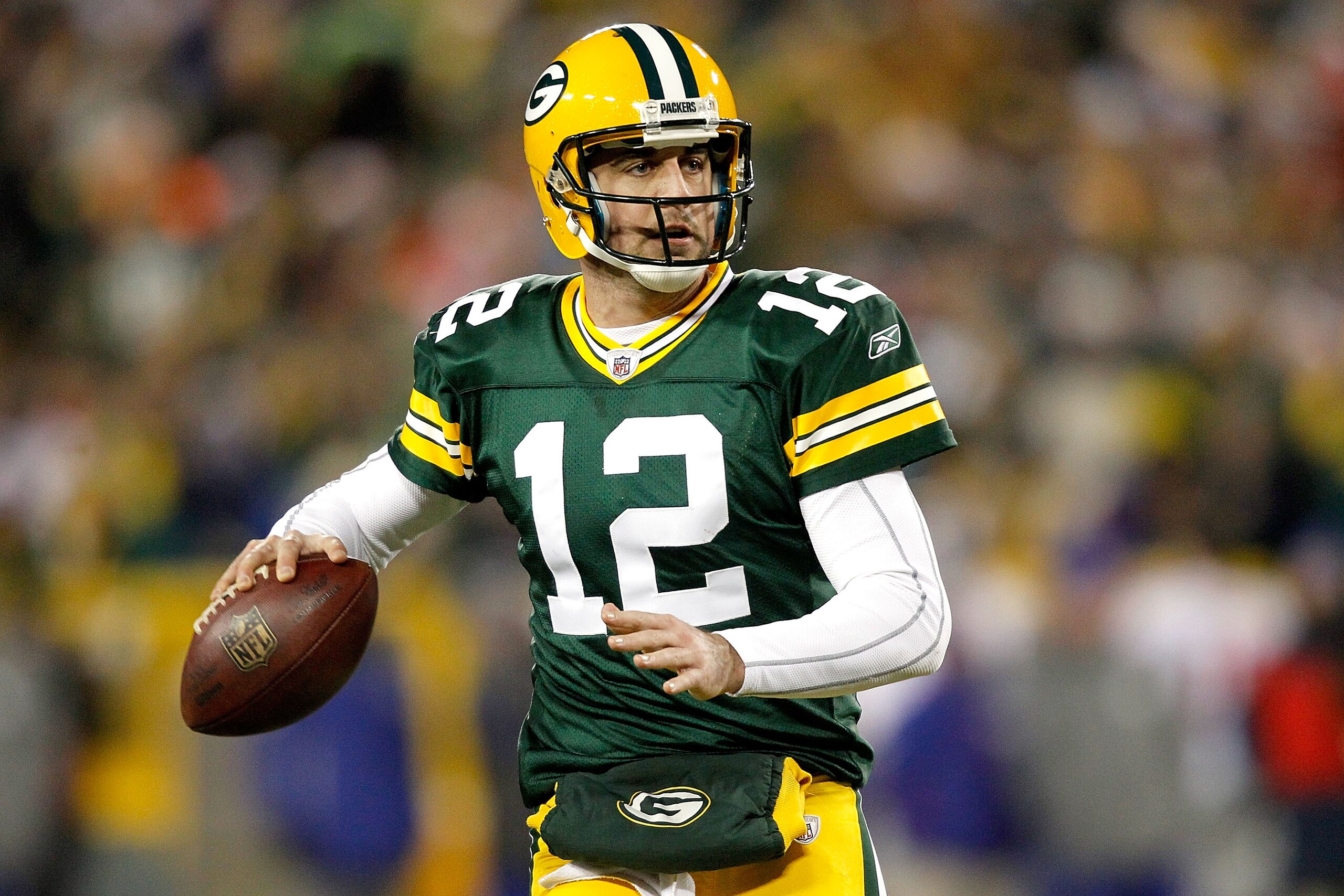 GREEN BAY, WI - DECEMBER 26: Aaron Rodgers #12 of the Green Bay Packers rolls out of the pocket against the New York Giants at Lambeau Field on December 26, 2010 in Green Bay, Wisconsin. (Photo by Matthew Stockman/Getty Images) GREEN BAY, WI - DECEMBER 26: Aaron Rodgers #12 of the Green Bay Packers rolls out of the pocket against the New York Giants at Lambeau Field on December 26, 2010 in Green Bay, Wisconsin. (Photo by Matthew Stockman/Getty Images)