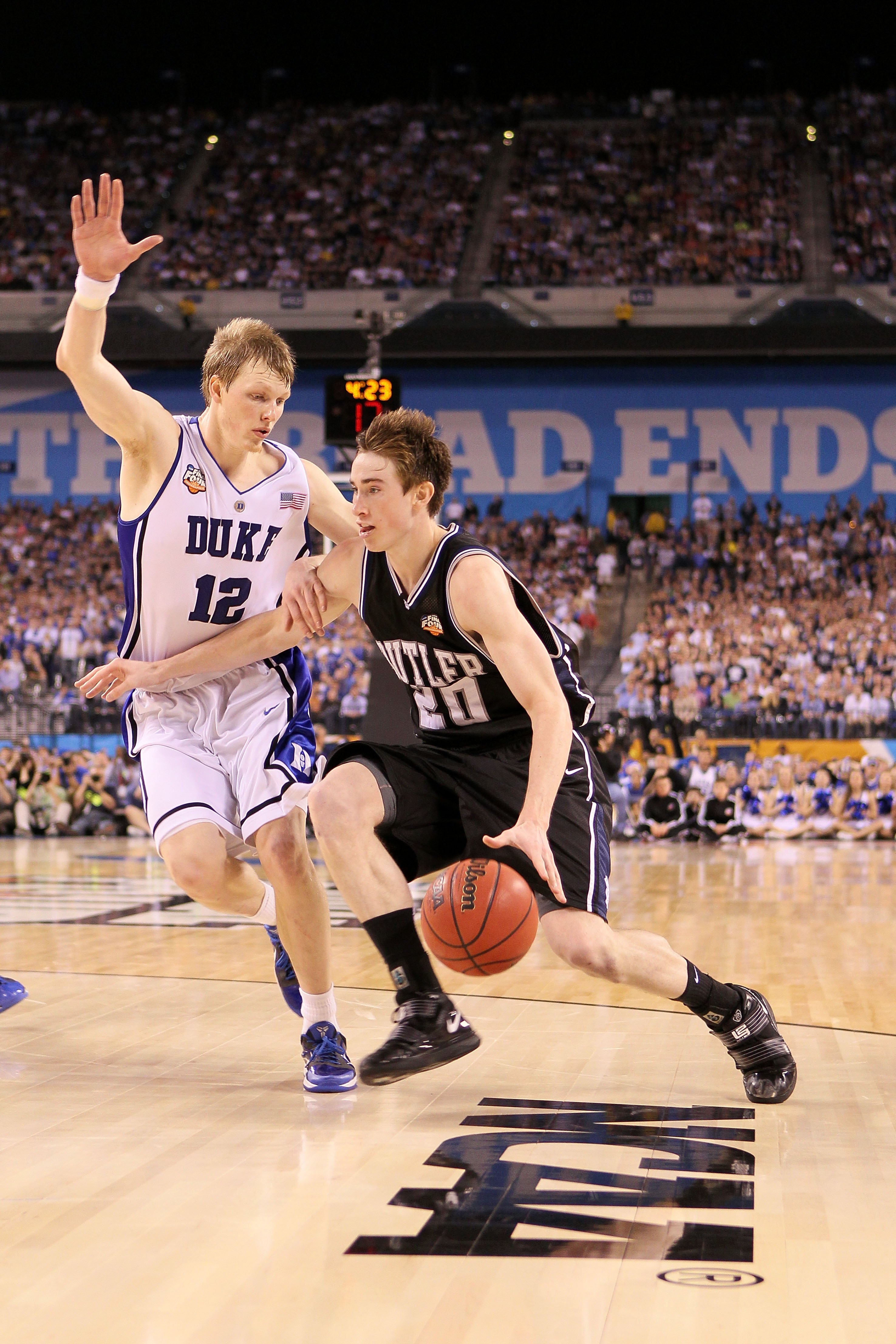 INDIANAPOLIS - APRIL 05:  Gordon Hayward #20 of the Butler Bulldogs drives against Kyle Singler #12 of the Duke Blue Devils during the 2010 NCAA Division I Men's Basketball National Championship game at Lucas Oil Stadium on April 5, 2010 in Indianapolis,