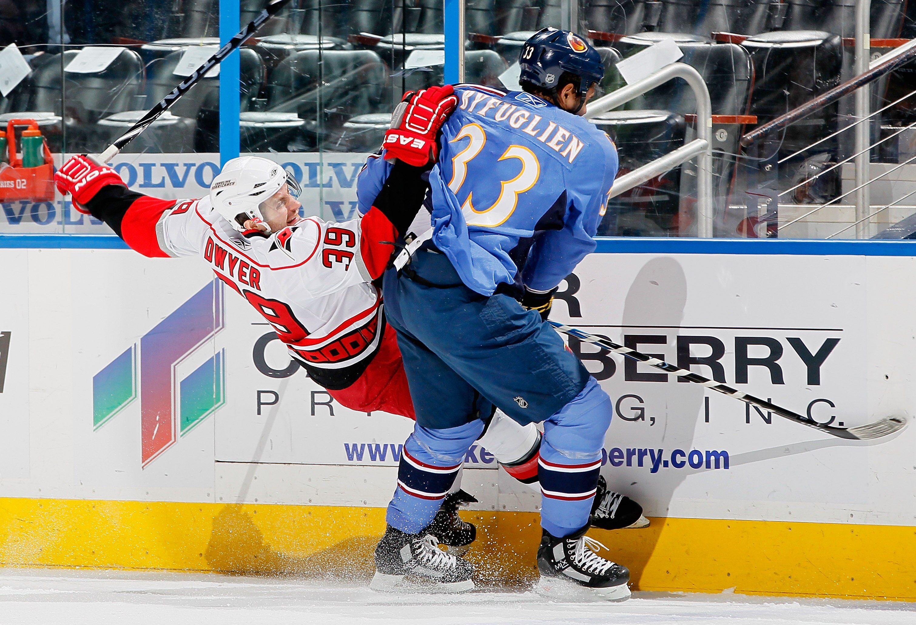 ATLANTA, GA - DECEMBER 16:  Dustin Byfuglien #33 of the Atlanta Thrashers against Patrick Dwyer #39 of the Carolina Hurricanes at Philips Arena on December 16, 2010 in Atlanta, Georgia.  (Photo by Kevin C. Cox/Getty Images)