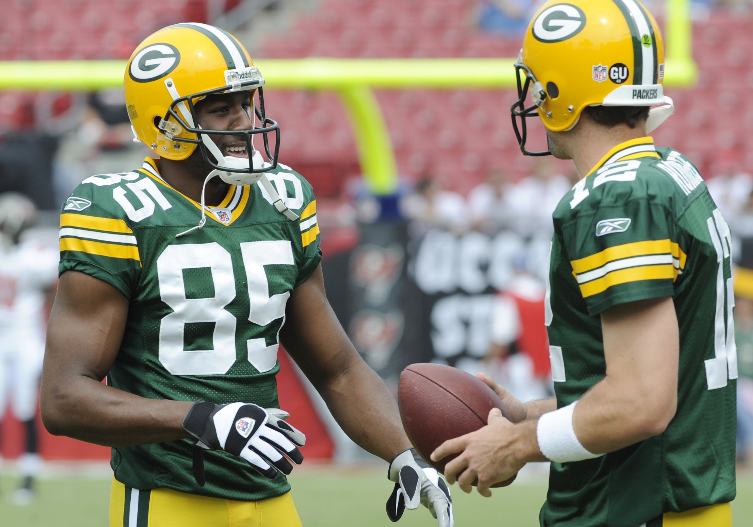 TAMPA, FL - SEPTEMBER 28: Wide receiver Greg Jennings #85 and quarterback Aaron Rodgers #12 of the Green Bay Packers  warm up before play against the Tampa Bay Buccaneers at Raymond James Stadium on September 28, 2008 in Tampa, Florida.  (Photo by Al Mess