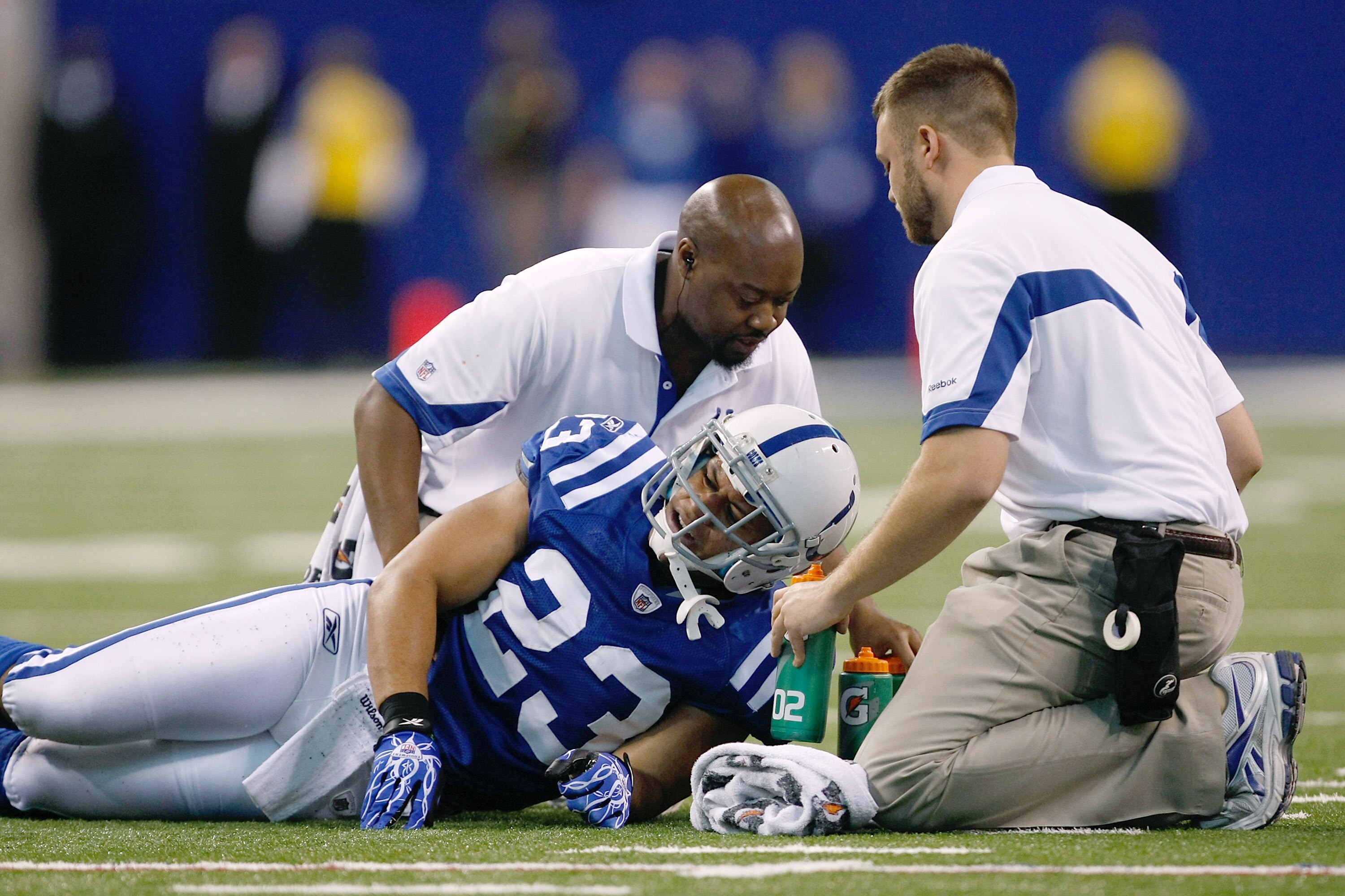 INDIANAPOLIS, IN - DECEMBER 19: Al Alfalava #23 of the Indianapolis Colts is attended to by trainers after an injury against the Jacksonville Jaguars at Lucas Oil Stadium on December 19, 2010 in Indianapolis, Indiana.   The Colts defeated the Jaguars 34-2
