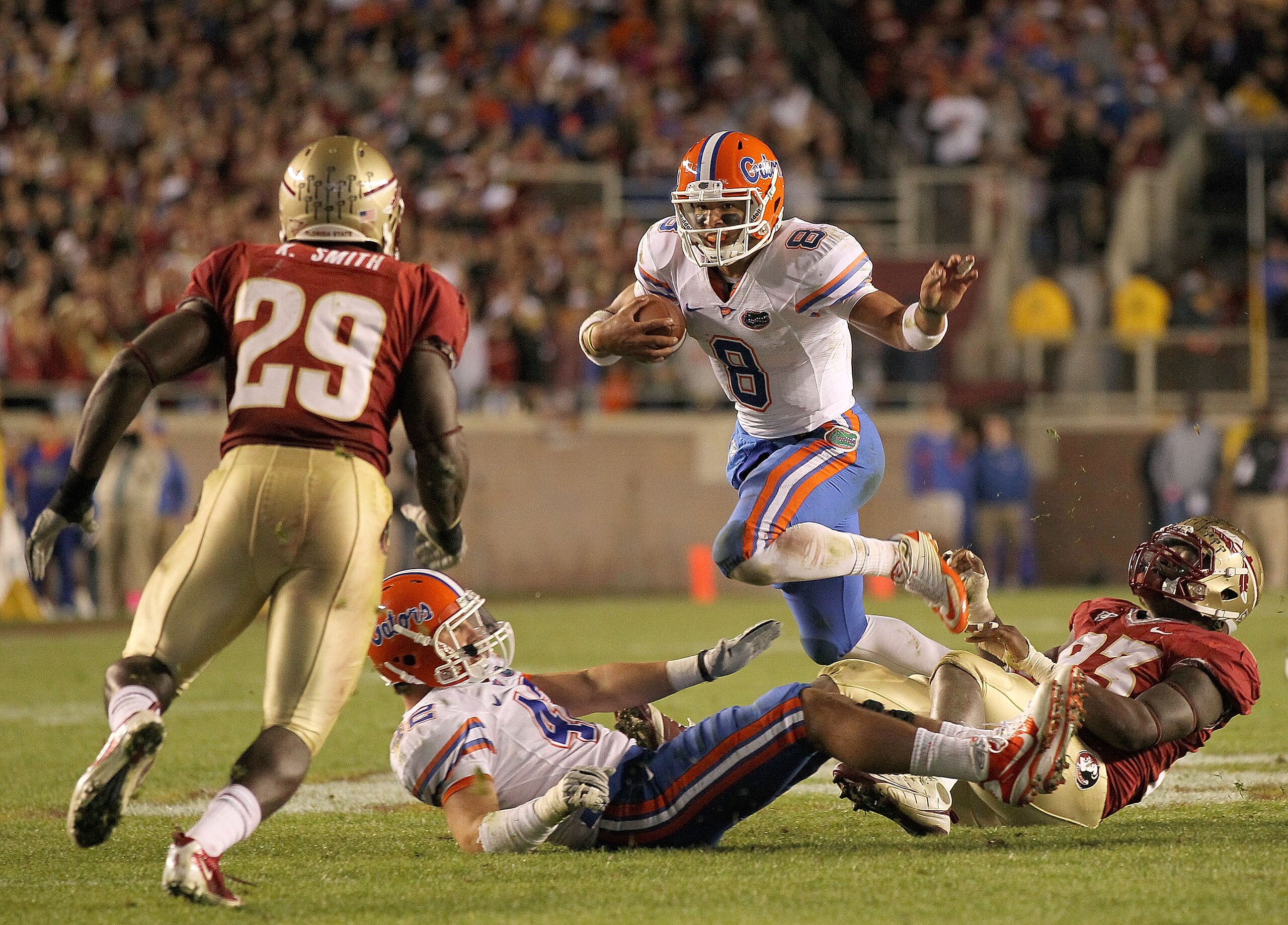 TALLAHASSEE, FL - NOVEMBER 27:  Trey Burton #8 of the Florida Gators rushes   during a game against the Florida State Seminoles at Doak Campbell Stadium on November 27, 2010 in Tallahassee, Florida.  (Photo by Mike Ehrmann/Getty Images)