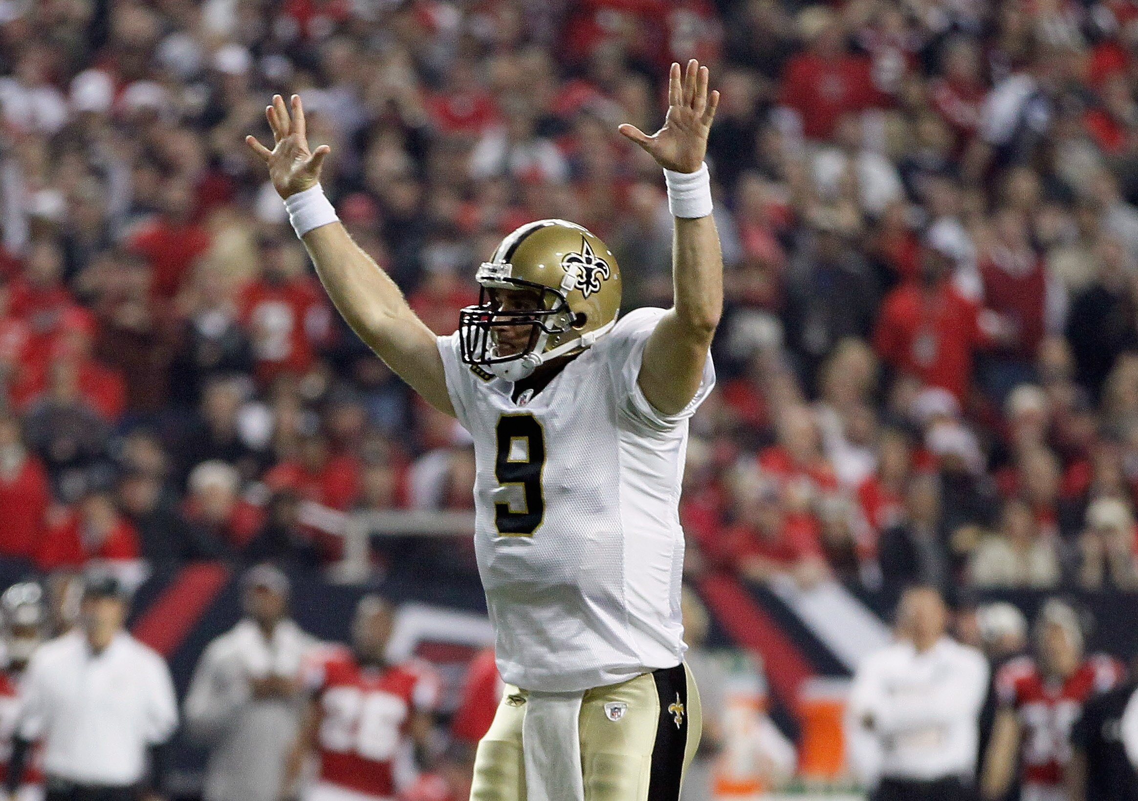 ATLANTA, GA - DECEMBER 27:  Quarterback Drew Brees #9 of the New Orleans Saints celebrates a touchdown pass in the first half during the game against the Atlanta Falcons at the Georgia Dome on December 27, 2010 in Atlanta, Georgia.  (Photo by Kevin C. Cox