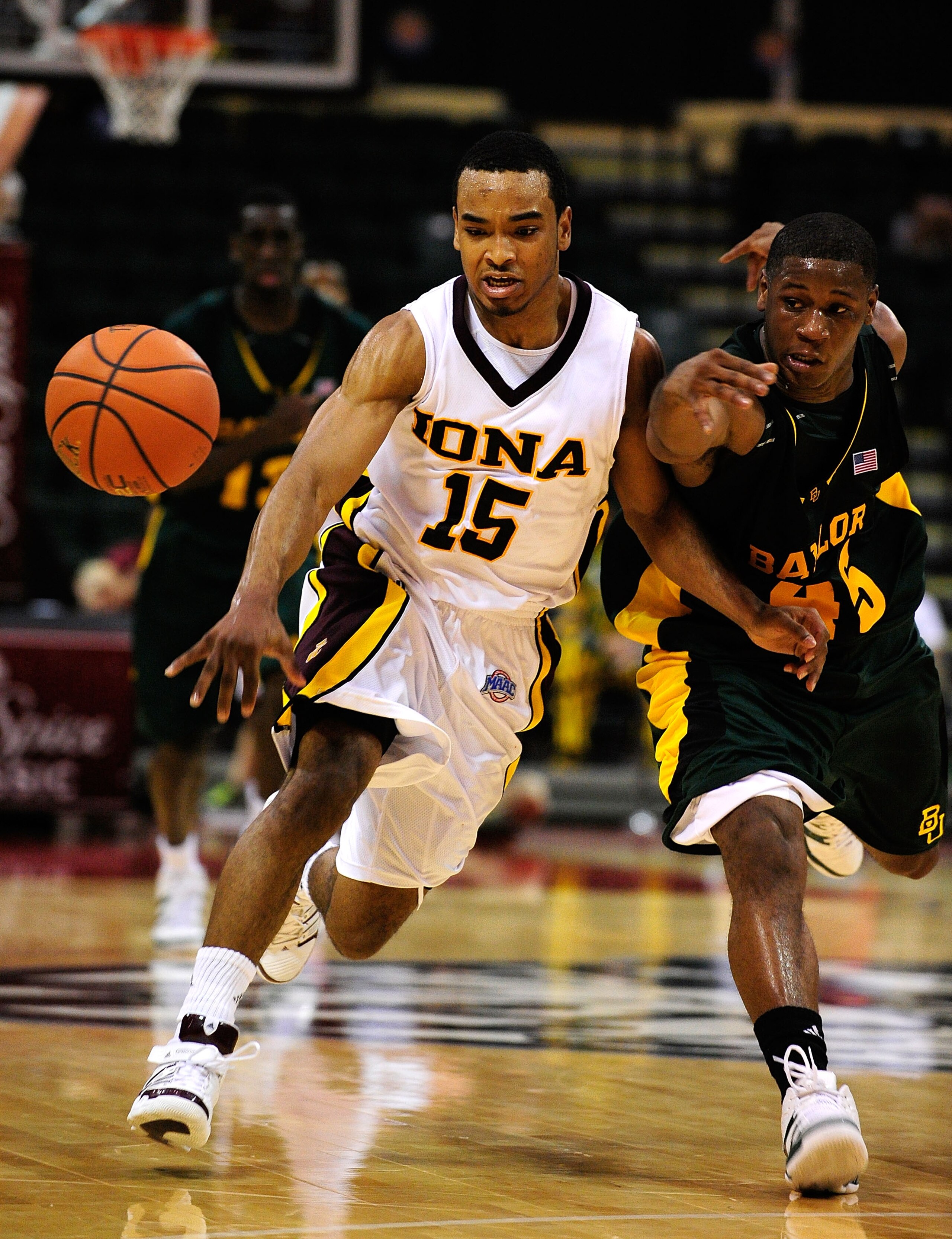 ORLANDO, FL - NOVEMBER 27:  Jermel Jenkins #15 of the Iona Gaels drives against Tweety Carter #45 of the Baylor Bears during the Old Spice Classic at Disney's Milk House on November 27, 2009 in Orlando, Florida.  (Photo by Sam Greenwood/Getty Images)