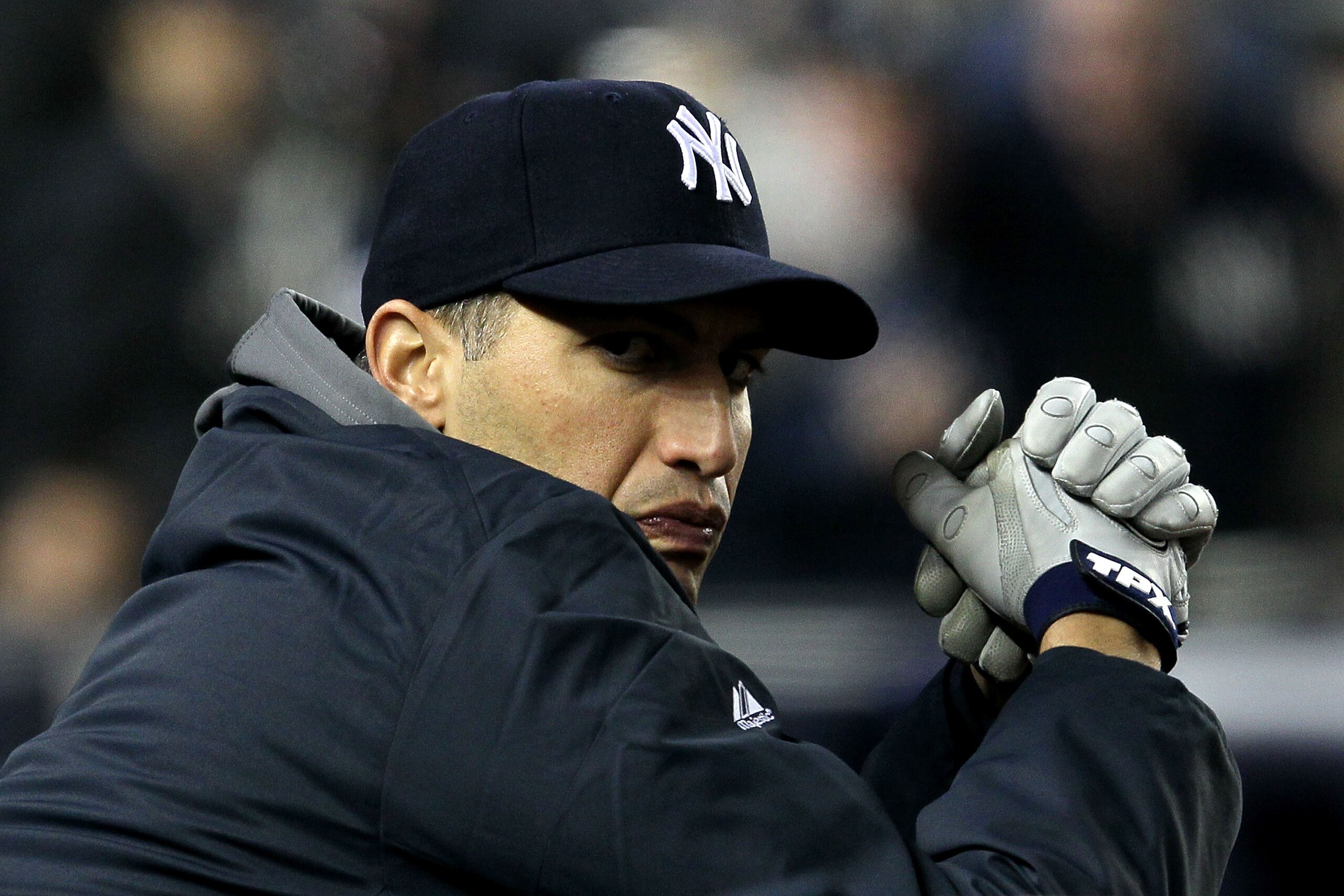 NEW YORK - OCTOBER 19:  Andy Pettitte #46 of the New York Yankees looks on from the dugout against the Texas Rangers in Game Four of the ALCS during the 2010 MLB Playoffs at Yankee Stadium on October 19, 2010 in the Bronx borough of New York City.  (Photo