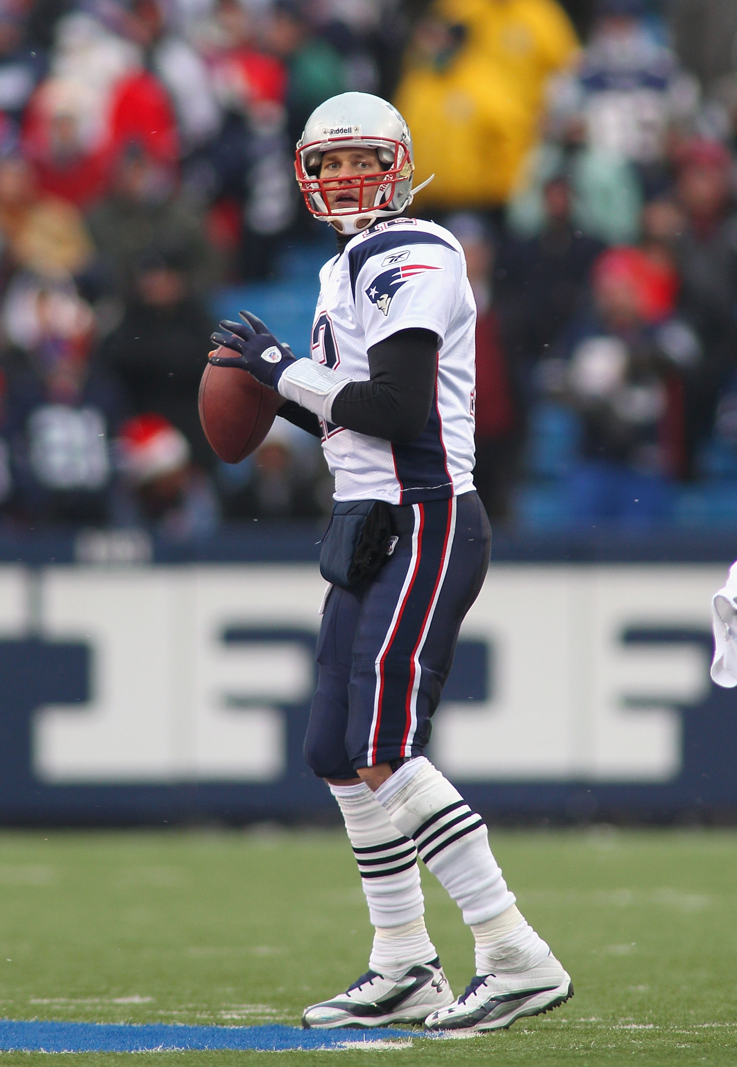 ORCHARD PARK, NY - DECEMBER 26:  Tom Brady #12 of the New England Patriots readies to throw a pass against the Buffalo Bills  at Ralph Wilson Stadium on December 26, 2010 in Orchard Park, New York.  New England won 34-3.  (Photo by Rick Stewart/Getty Imag