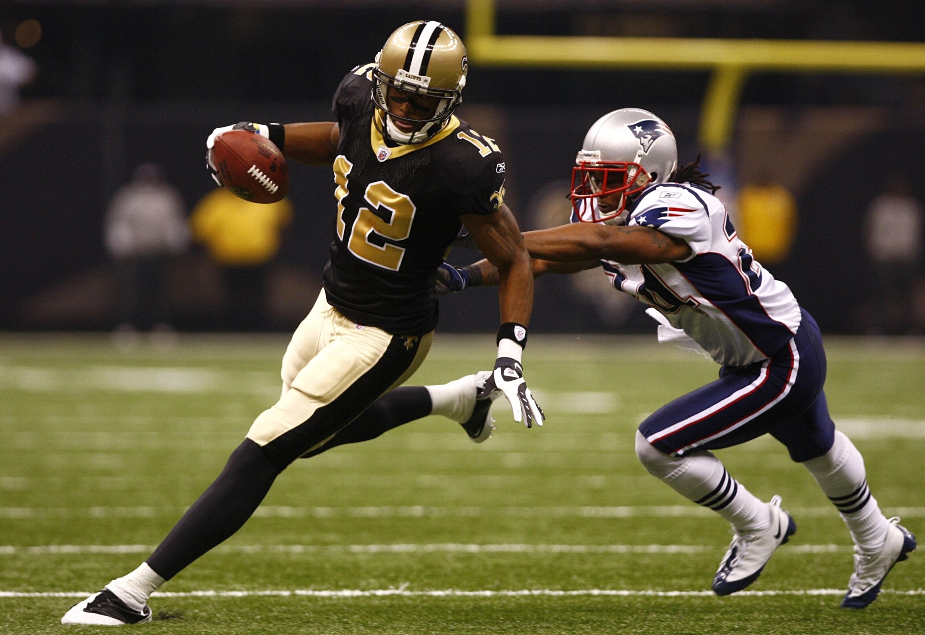NEW ORLEANS - NOVEMBER 30: Marques Colston #12 of the New Orleans Saints runs for yards after the catch against Jonathan Wilhite #24 of the New England Patriots at Louisana Superdome on November 30, 2009 in New Orleans, Louisiana. (Photo by Scott Halleran