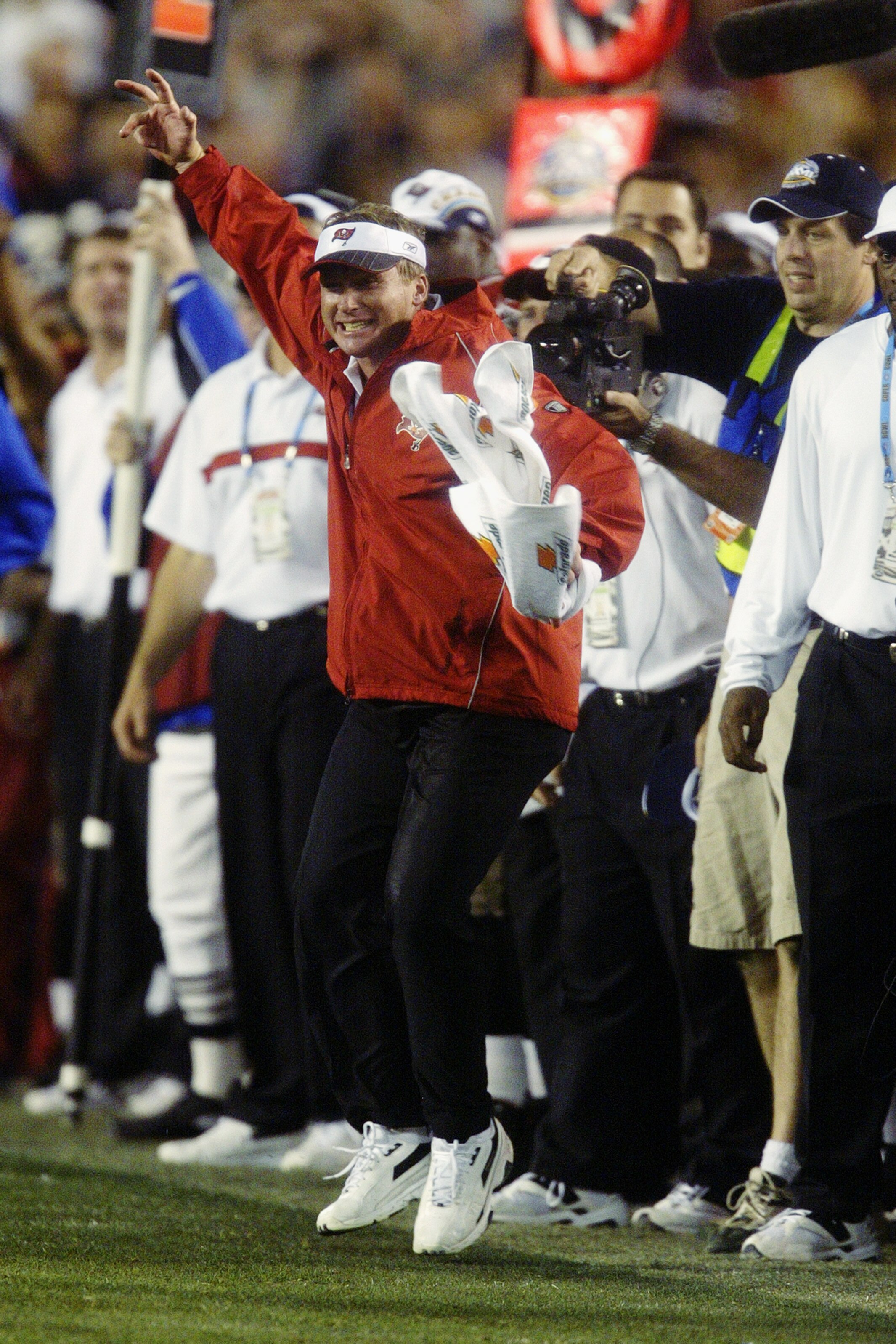 SAN DIEGO - JANUARY 26:  Head coach Jon Gruden of the Tampa Bay Buccaneers cheers as cornerback Dwight Smith makes a final touchdown off an Oakland Raiders fumble in the fourth quarter of Super Bowl XXXVII at Qualcomm Stadium on January 26, 2003 in San Di