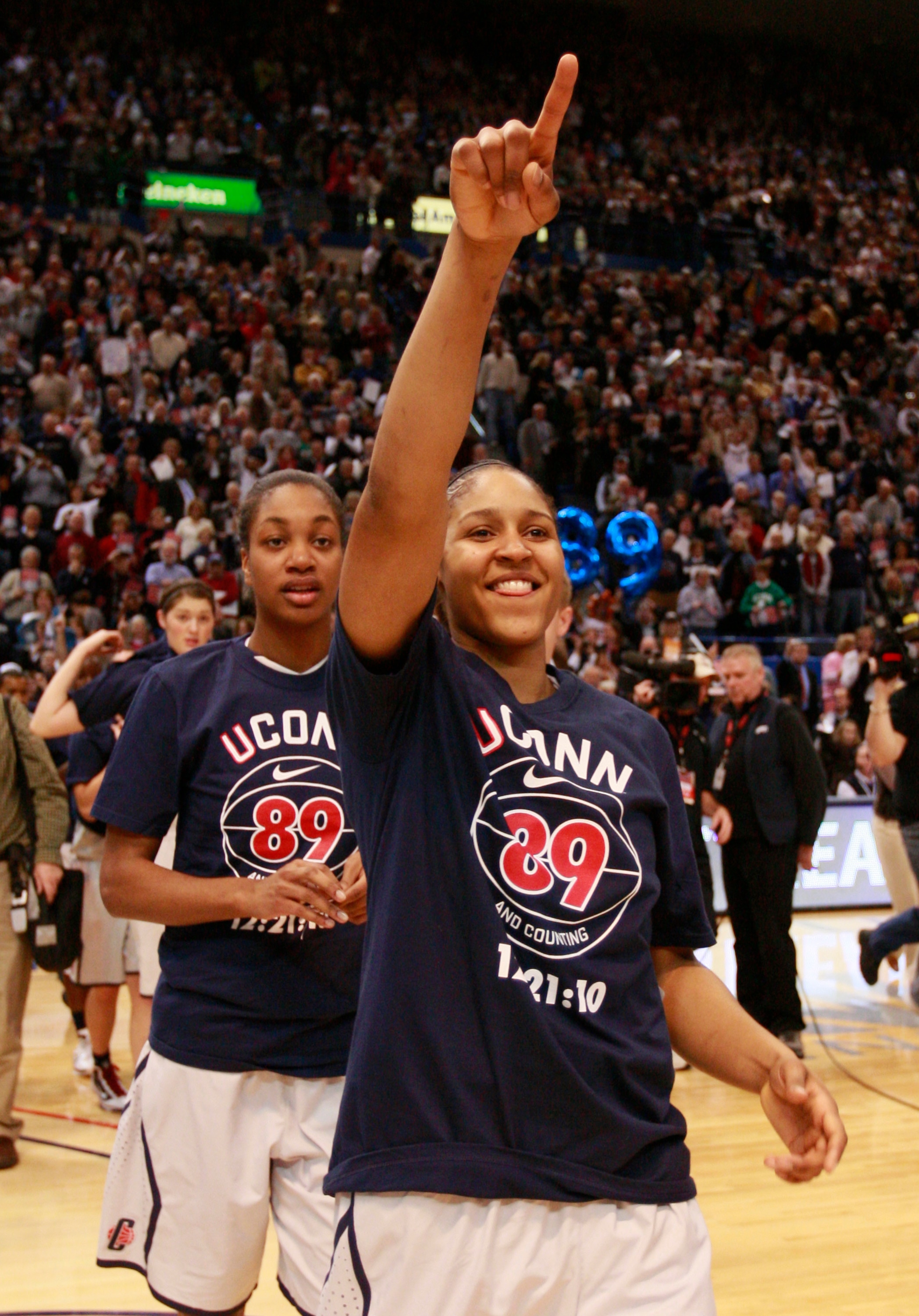 HARTFORD, CT - DECEMBER 21:  Maya Moore #23 and Michala Johnson #25 of the Connecticut celebrate after a win over Florida State on December 21, 2010 in Hartford, Connecticut.  Connecticut set a record with 89 straight wins without a defeat. (Photo by Jim