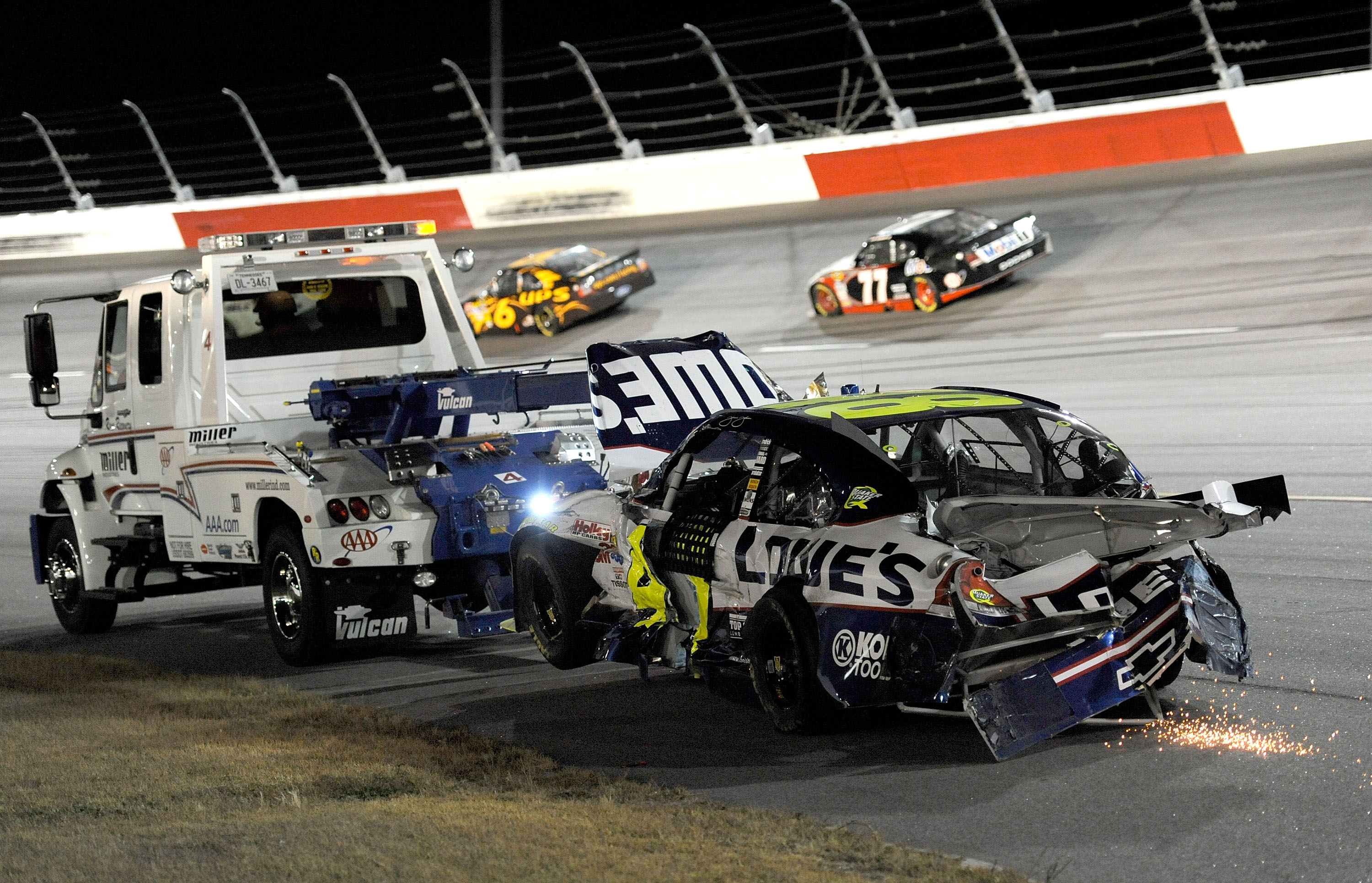 DARLINGTON, SC - MAY 08:  The #48 Lowe's Chevrolet, driven by Jimmie Johnson (not pictured) is towed off the track during the NASCAR Sprint Cup series SHOWTIME Southern 500 at Darlington Raceway on May 8, 2010 in Darlington, South Carolina.  (Photo by Joh