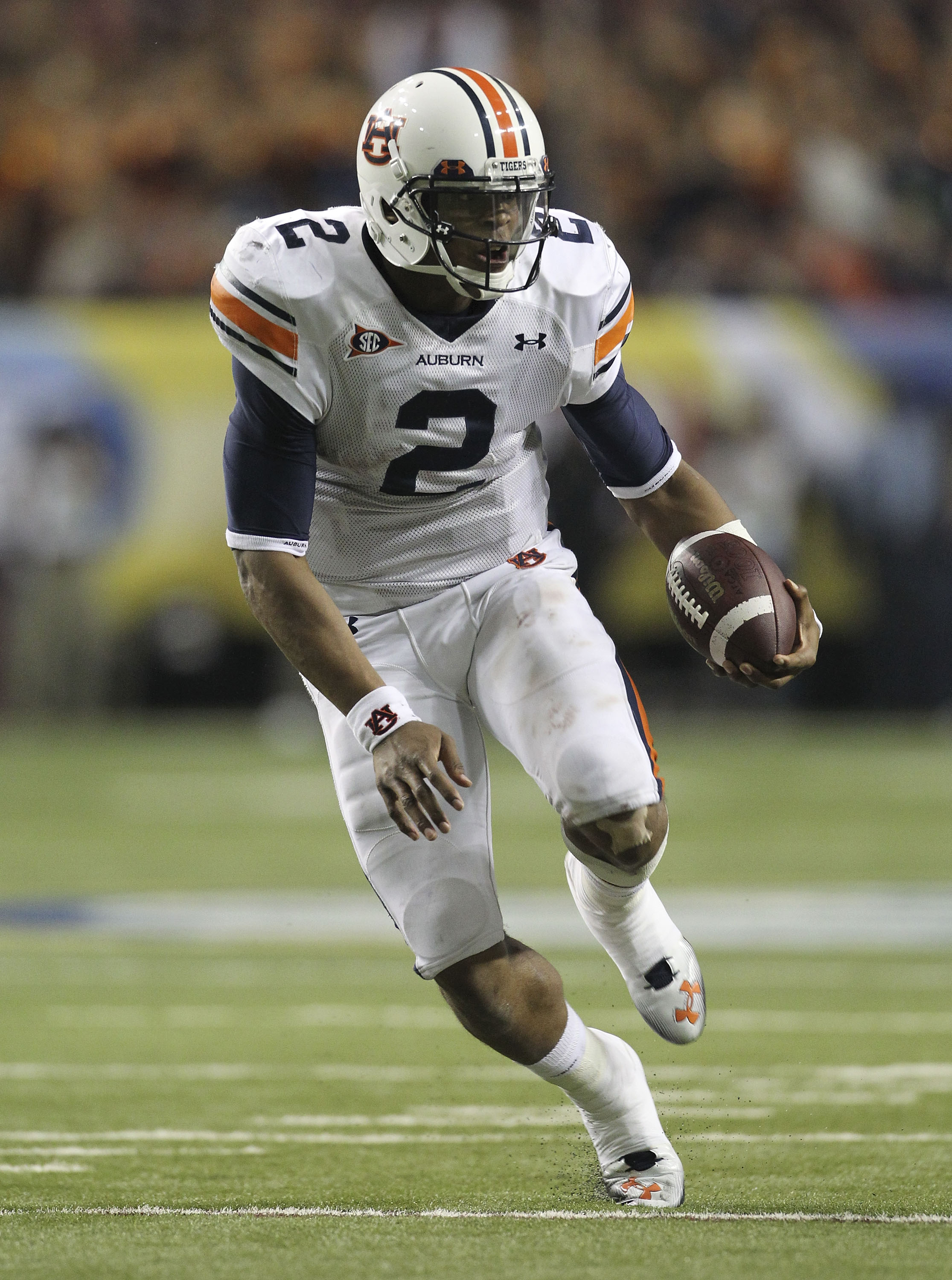 ATLANTA - DECEMBER 04:  Quarterback Cam Newton #2 of the Auburn Tigers runs with the ball during the 2010 SEC Championship against the South Carolina Gamecocks at Georgia Dome on December 4, 2010 in Atlanta, Georgia.  (Photo by Mike Zarrilli/Getty Images)