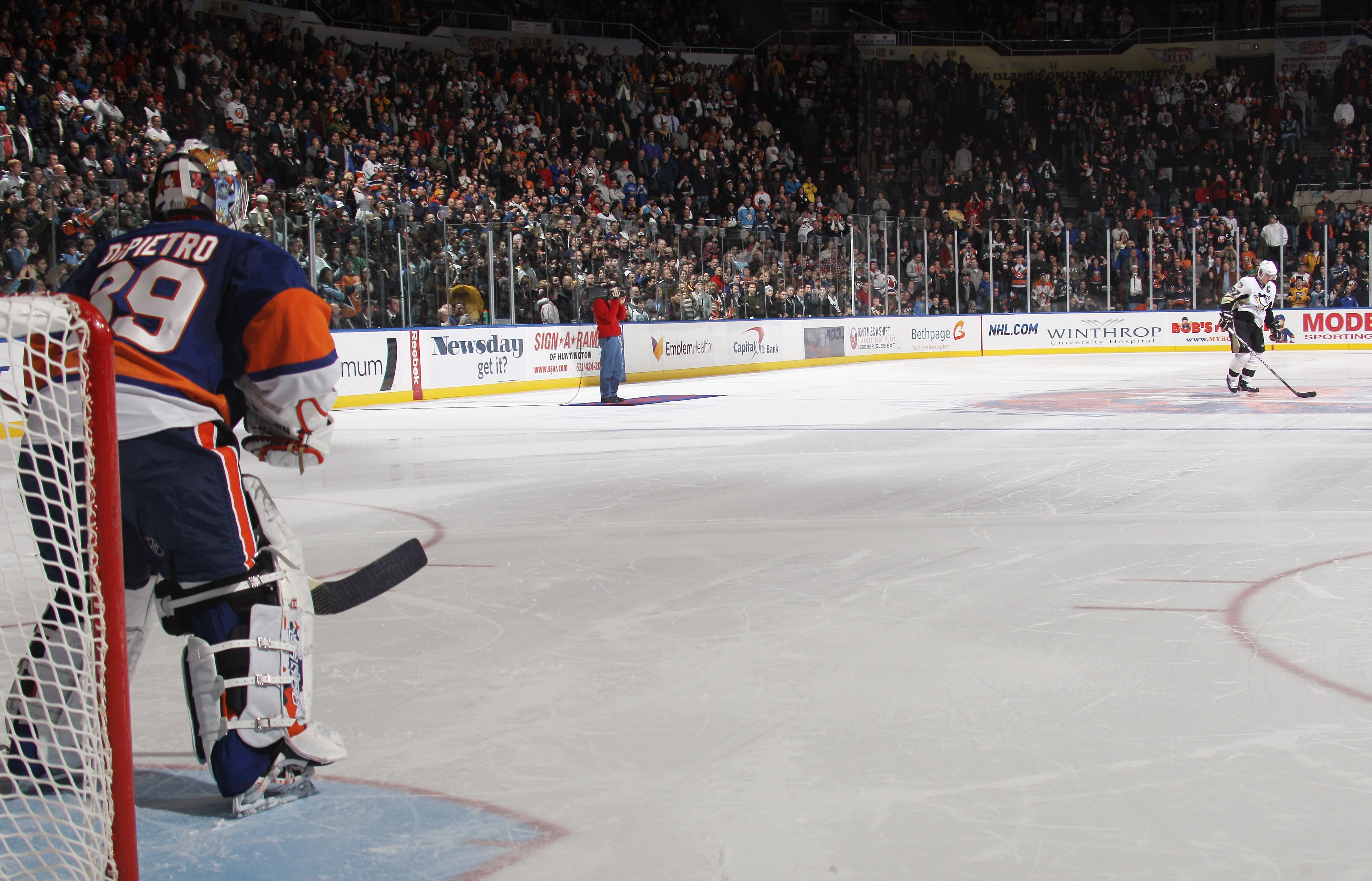 UNIONDALE, NY - DECEMBER 29: Sidney Crosby #87 of the Pittsburgh Penguins prepares for his shoot out attempt against Rick DiPietro #39 of the New York Islanders at the Nassau Coliseum on December 29, 2010 in Uniondale, New York. The Islanders defeated the