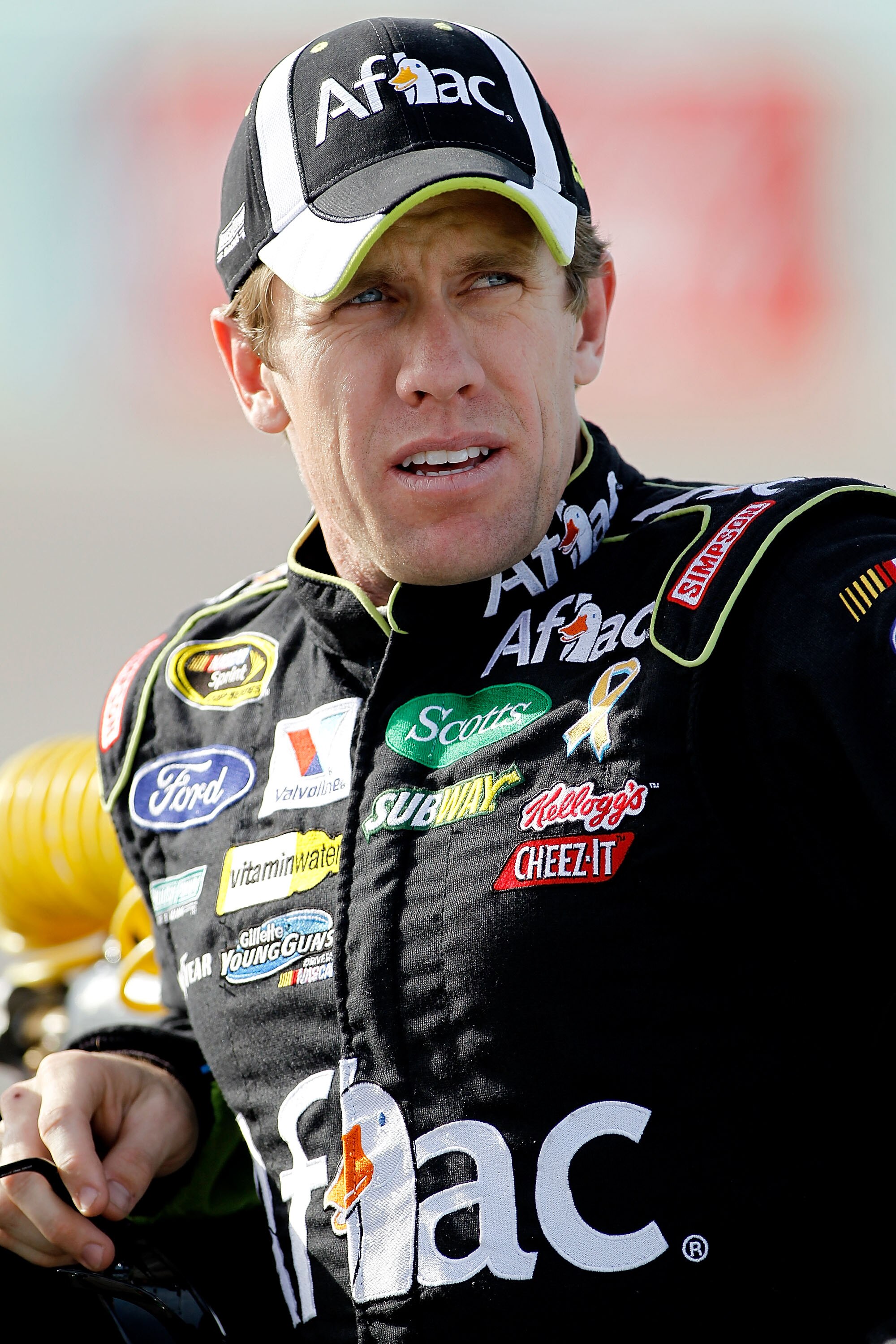 HOMESTEAD, FL - NOVEMBER 19:  Carl Edwards, driver of the #99 Aflac Ford, stands on the grid during qualifying for the NASCAR Sprint Cup Series Ford 400 at Homestead-Miami Speedway on November 19, 2010 in Homestead, Florida.  (Photo by Todd Warshaw/Getty