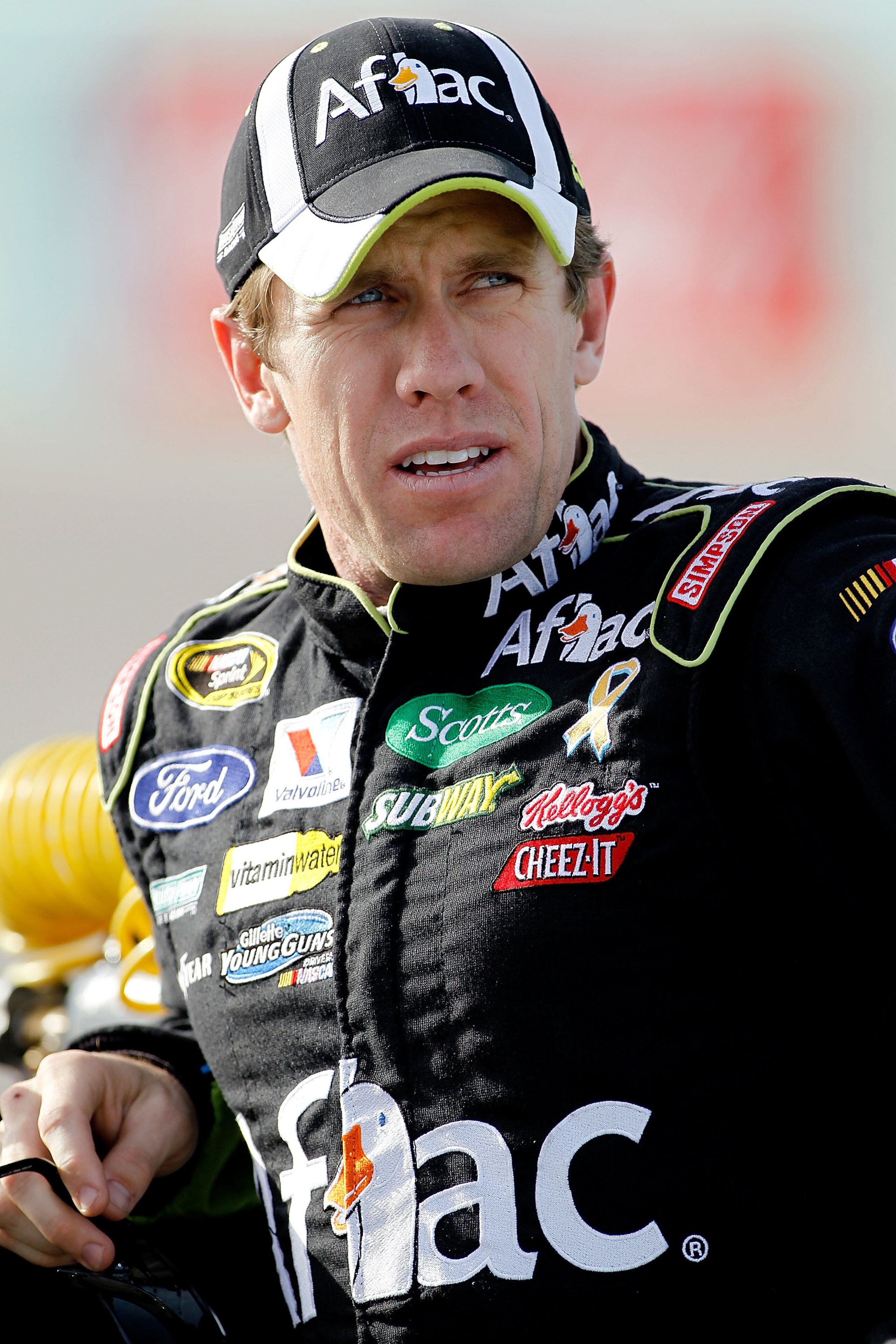 HOMESTEAD, FL - NOVEMBER 19:  Carl Edwards, driver of the #99 Aflac Ford, stands on the grid during qualifying for the NASCAR Sprint Cup Series Ford 400 at Homestead-Miami Speedway on November 19, 2010 in Homestead, Florida.  (Photo by Todd Warshaw/Getty
