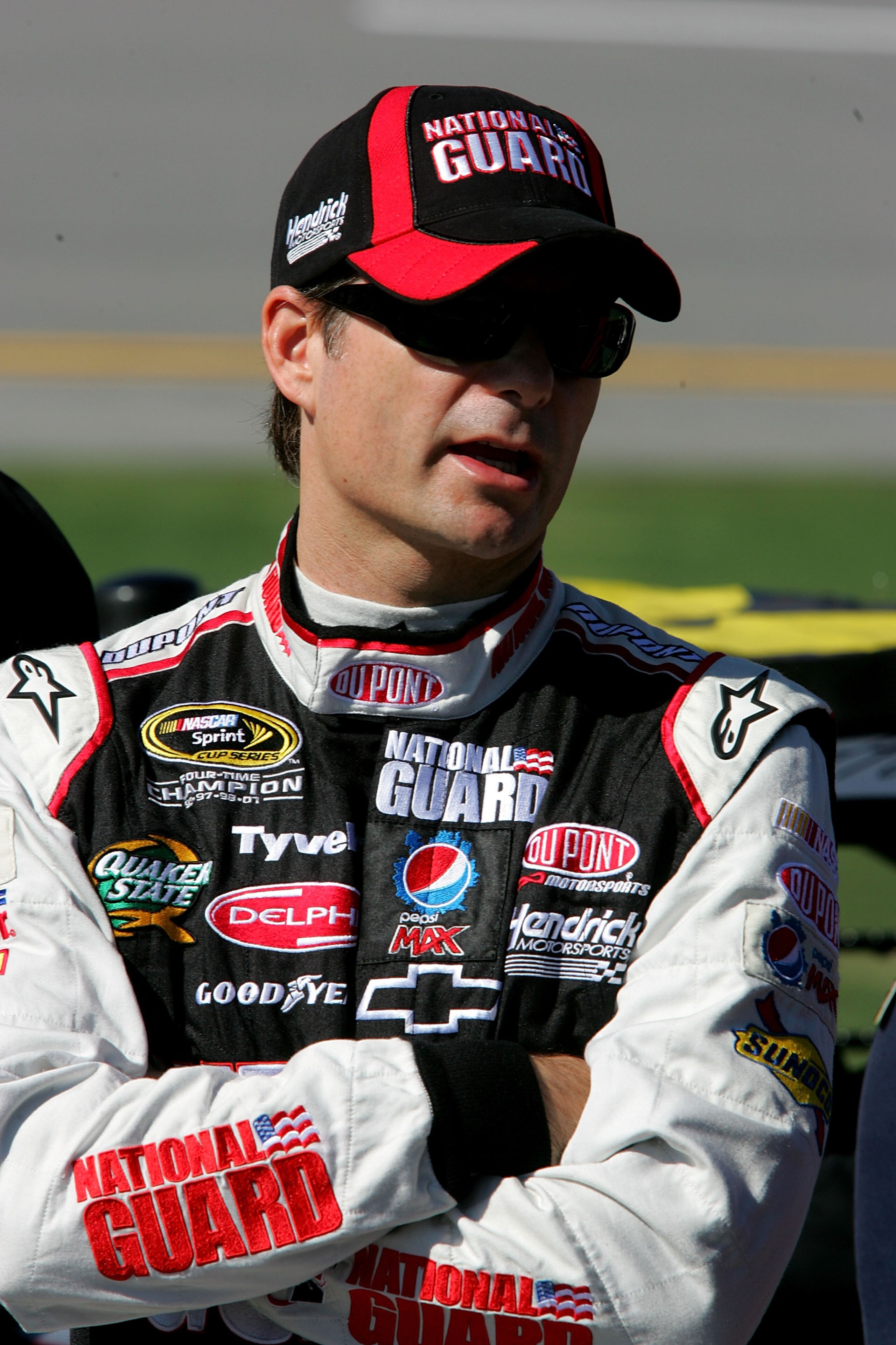 TALLADEGA, AL - OCTOBER 30:  Jeff Gordon, driver of the #24 DuPont/National Guard Chevrolet, stands next to his car on pit road during qualifying for the NASCAR Sprint Cup Series AMP Energy Juice 500 at Talladega Superspeedway on October 30, 2010 in Talla