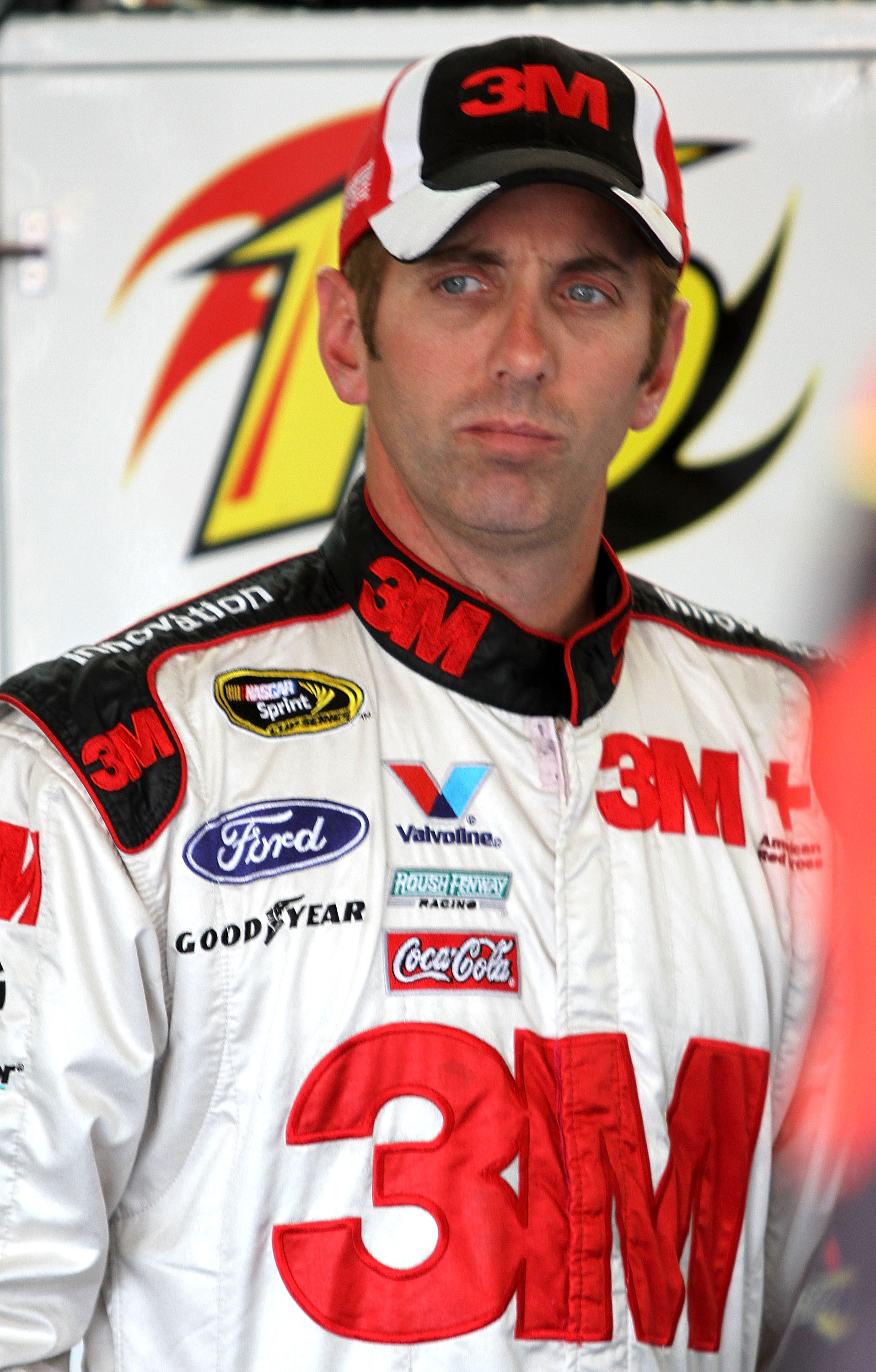 CONCORD, NC - OCTOBER 14:  Greg Biffle, driver of the #16 Scotch Blue Ford, stands in garage during practice for the NASCAR Sprint Cup Series Bank of America 500 at Charlotte Motor Speedway on October 14, 2010 in Concord, North Carolina.  (Photo by Jerry