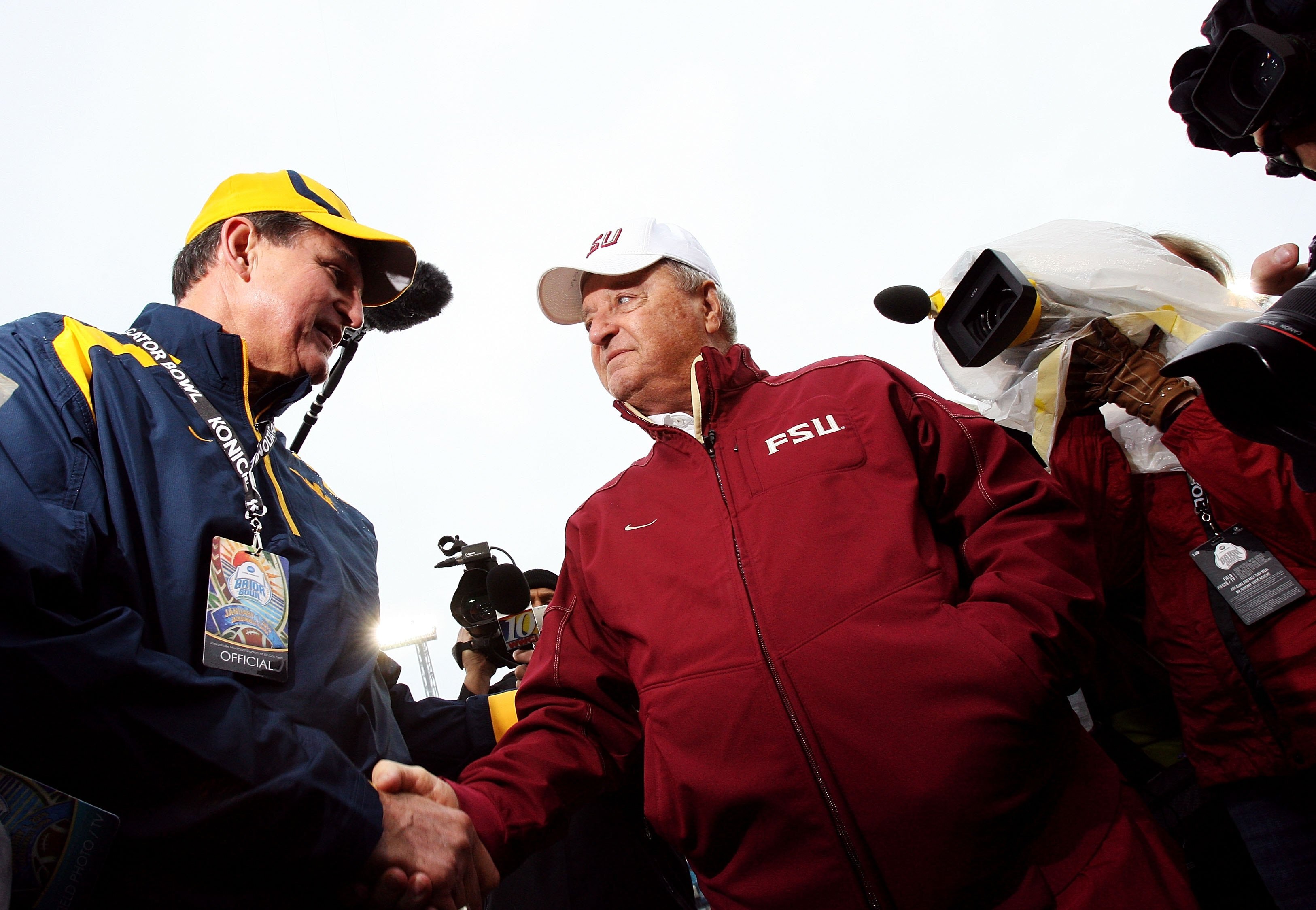 JACKSONVILLE, FL - JANUARY 01:  Head coach Bobby Bowden of the Florida State Seminoles is greeted by the Governor of West Virginia, Joe Manchin III, before taking on the West Virginia Mountaineers during the Konica Minolta Gator Bowl on January 1, 2010 at