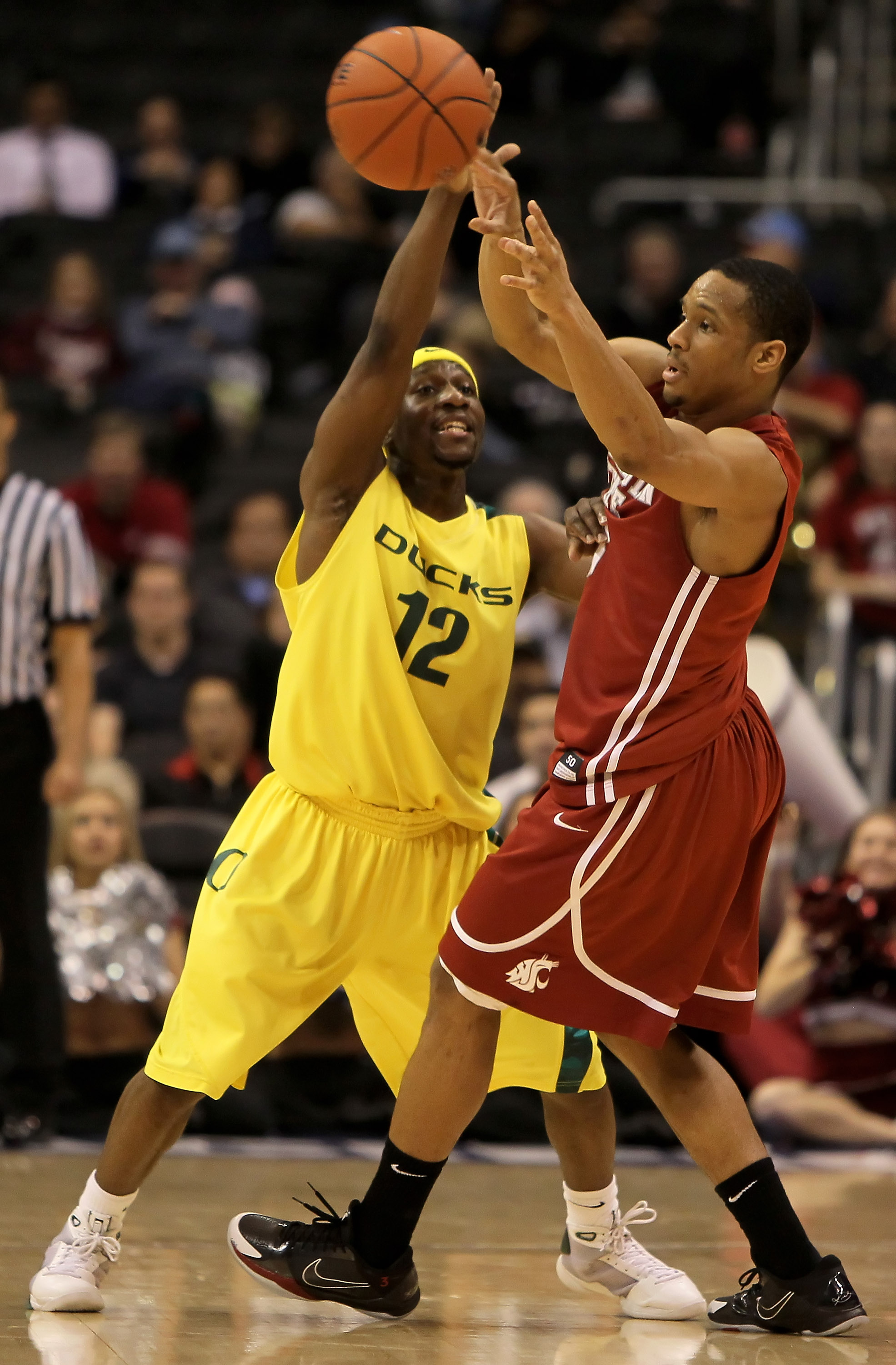 LOS ANGELES, CA - MARCH 10:  Reggie Moore #3 of the Washington State Cougars is defended by Tajuan Porter #12 of the Oregon Ducks in the second half during the first round of the Pac-10 Basketball Tournament at Staples Center on March 10, 2010 in Los Ange