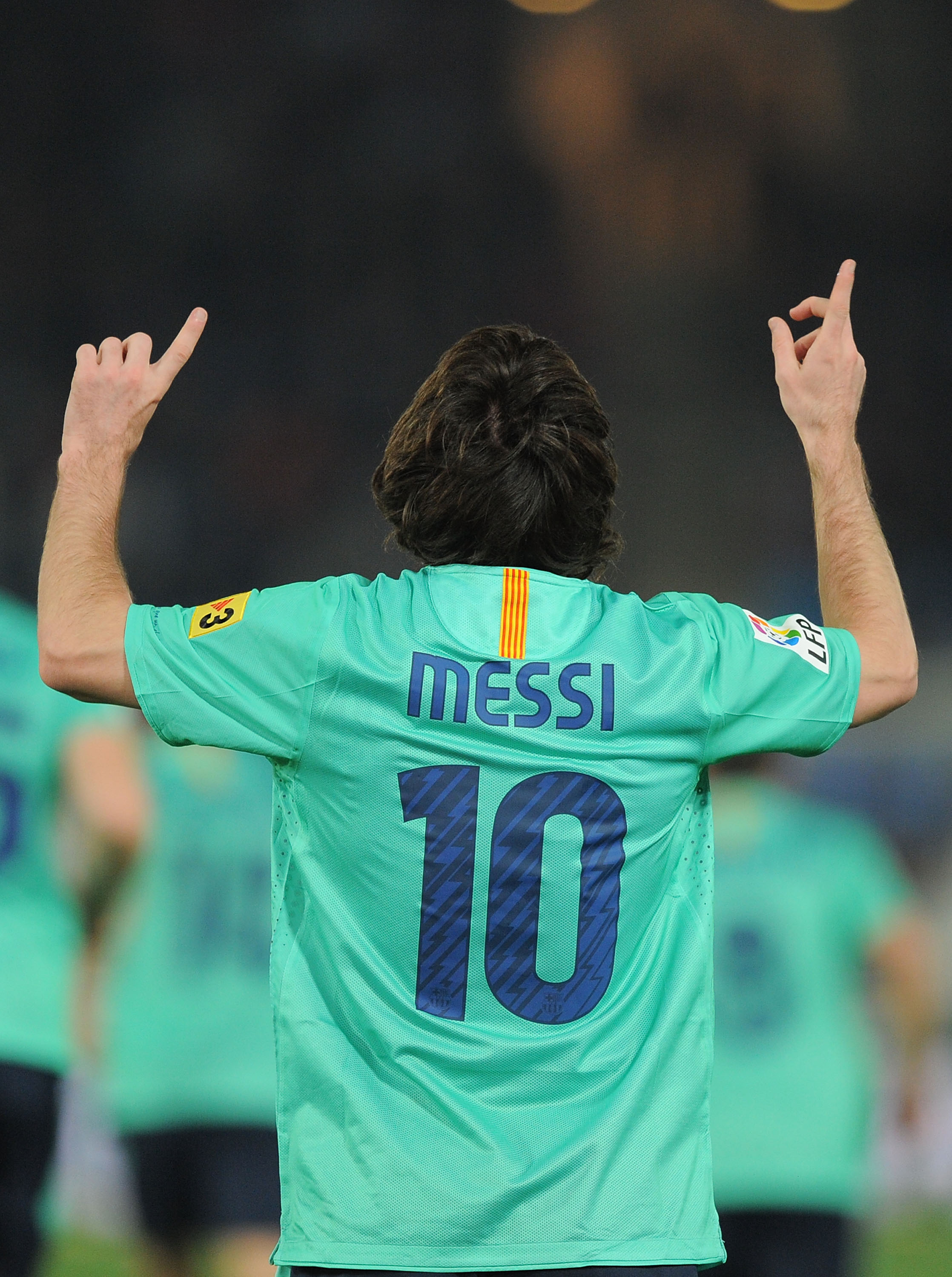 ALMERIA, SPAIN - NOVEMBER 20:  Lionel Messi of Barcelona celebrates after scoring Barcelona's opening goal during the La Liga match between UD Almeria and Barcelona at Estadio del Mediterraneo on November 20, 2010 in Almeria, Spain.  (Photo by Denis Doyle