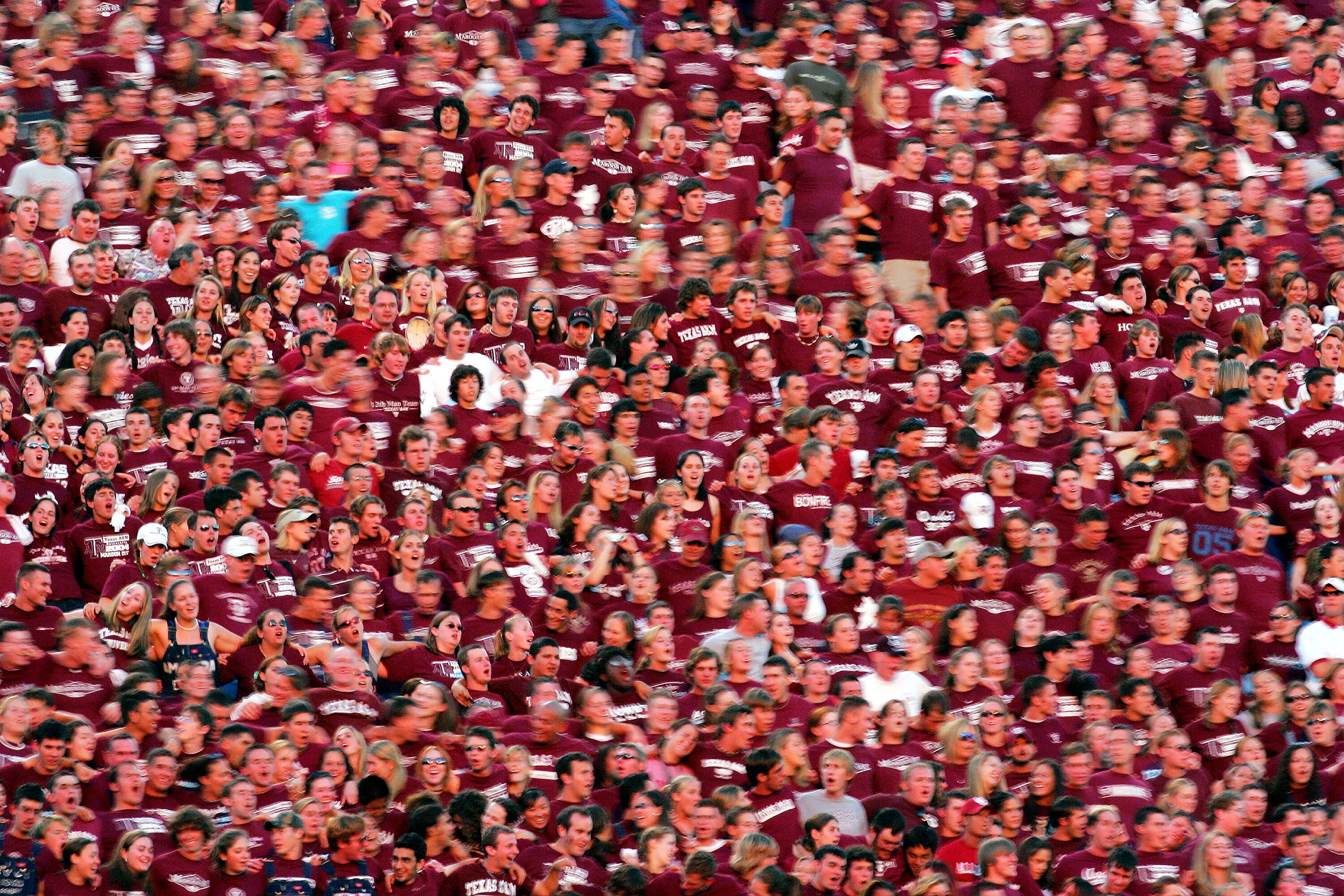 COLLEGE STATION, TX - NOVEMBER 6:  Texas A&M University Aggies fans sway back and forth during a yell against the University of Oklahoma Sooners on November 6, 2004 at Kyle Field in College Station, Texas.  (Photo by Ronald Martinez/Getty Images)