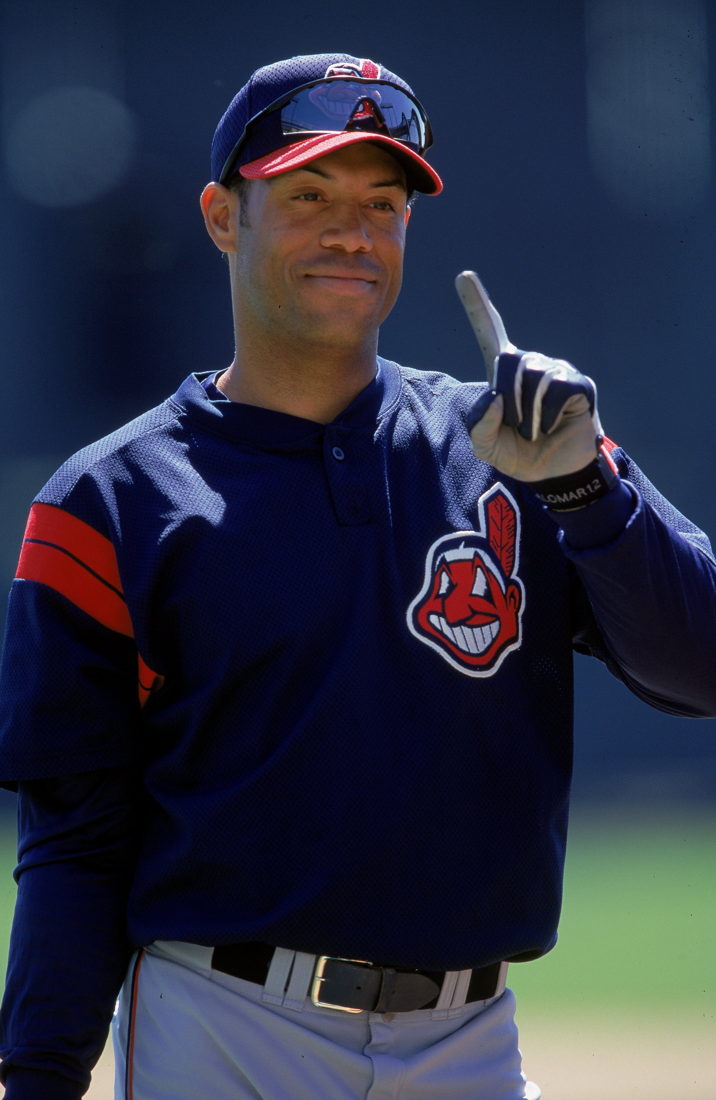 12 Mar 2000: Roberto Alomar #12 of the Cleveland Indians signals number one as he stands on the field during a Spring Training Game against the Atlanta Braves at Disney Wide World of Sports in Orlando, Florida. Mandatory Credit: Andy Lyons  /Allsport