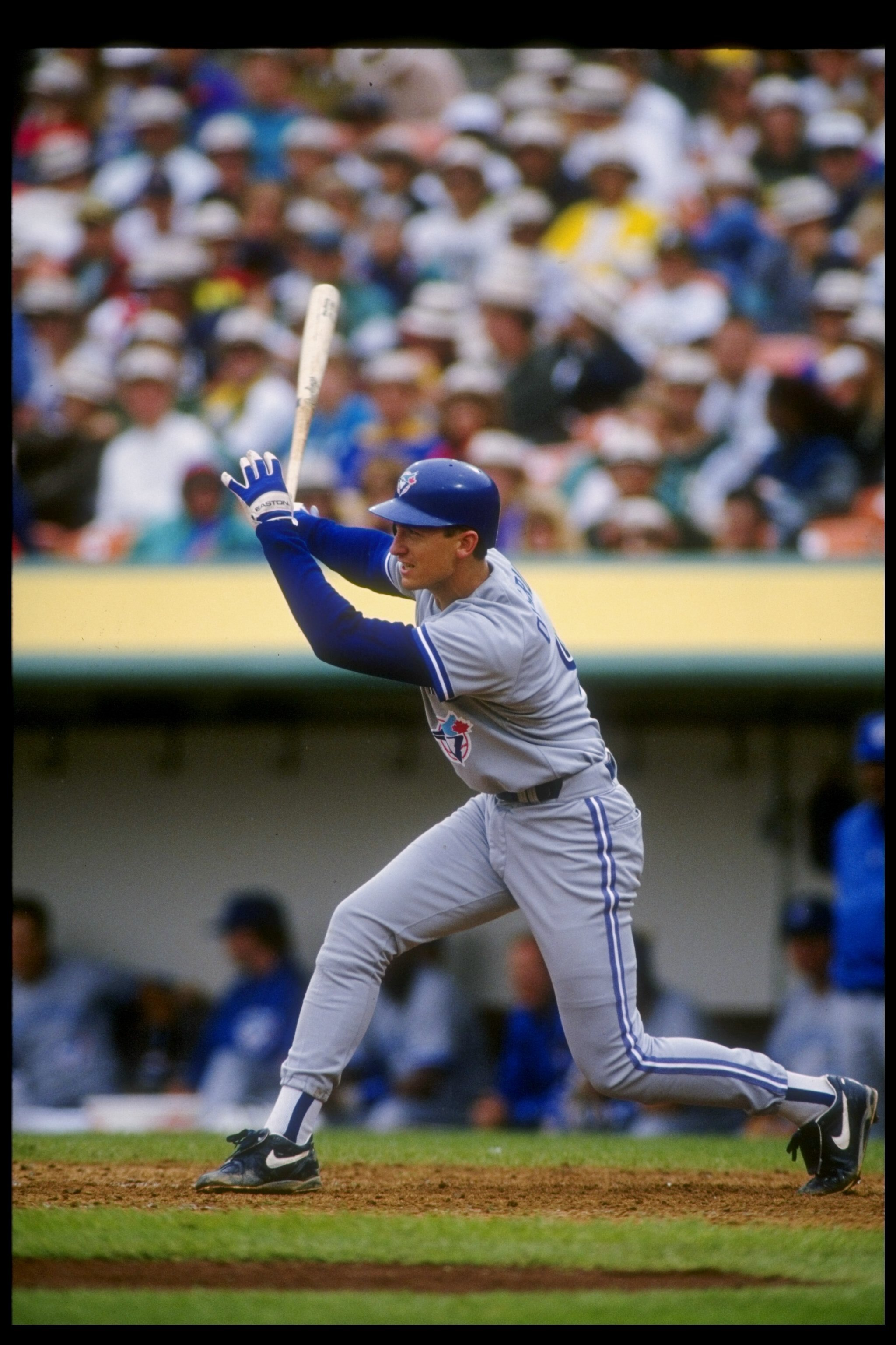 30 May 1993:  Infielder John Olerud of the Toronto Blue Jays swings at the ball during a game against the Oakland Athletics at the Oakland Coliseum in Oakland, California.  Mandatory Credit: Otto Greule  /Allsport