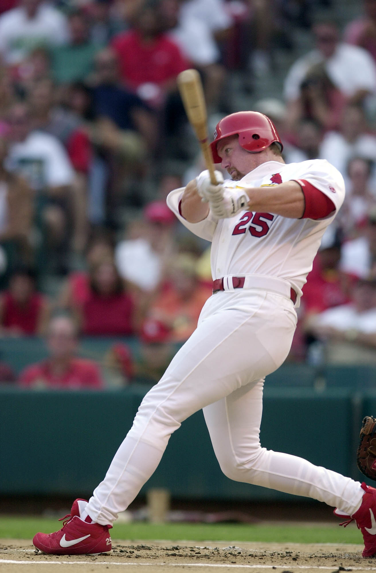 01 Aug 2000:  Mark McGwire #25 of the St. Louis Cardinals swings during the game against the Atlanta Braves at Busch Stadium in St. Louis, Missouri.  The Cardinals beat the Atlanta Braves 0-4.  DIGITAL IMAGE. Mandatory Credit: Elsa/ALLSPORT