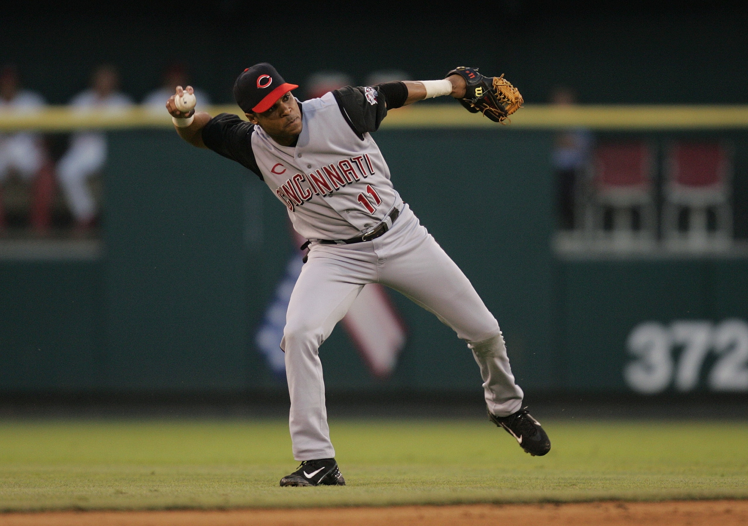 ST. LOUIS - JUNE 18:  Infielder Barry Larkin #11 of the Cincinnati Reds throws the ball against the St. Louis Cardinals during the game at Busch Stadium on June 18, 2004 in St. Louis, Missouri.  The Cardinals defeated the Reds 4-3.  (Photo by Dilip Vishwa