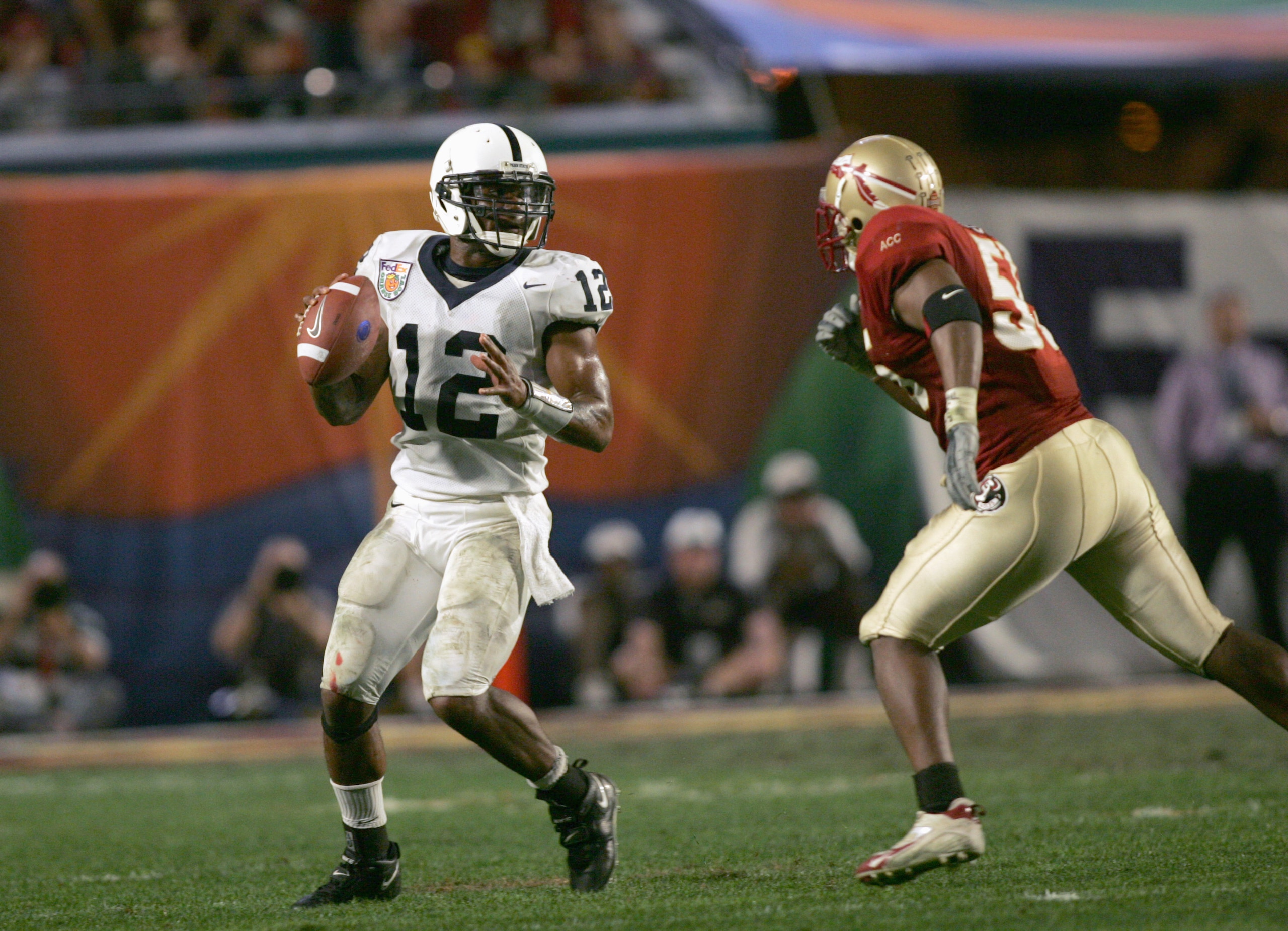 MIAMI GARDENS, FL - JANUARY 3: Quarterback Michael Robinson #12 of the Penn State Nittany Lions looks to pass during the 72nd Fed Ex Orange Bowl against the Florida State Seminoles at Dolphins Stadium on January 3, 2005 in Miami Gardens, Florida. Penn St MIAMI GARDENS, FL - JANUARY 3: Quarterback Michael Robinson #12 of the Penn State Nittany Lions looks to pass during the 72nd Fed Ex Orange Bowl against the Florida State Seminoles at Dolphins Stadium on January 3, 2005 in Miami Gardens, Florida. Penn St