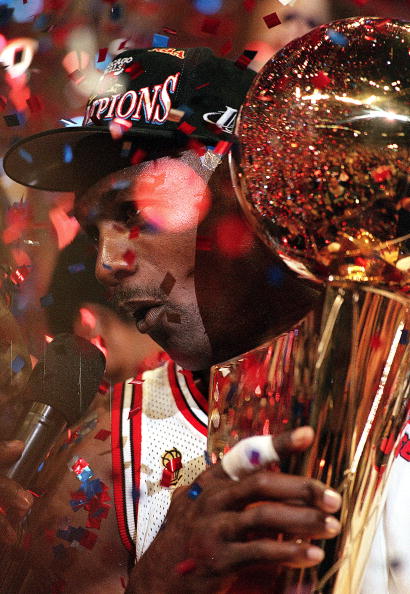 I3 Jun 1997:  Michael Jordan #23 of the Chicago Bulls celebrates as he holds the NBA Trophy after game six of the NBA Final against the Utah Jazz at the United Center in Chicago, Illinois. The Bulls defeated the Jazz 90-86..   Mandatory Credit: Jonathan D