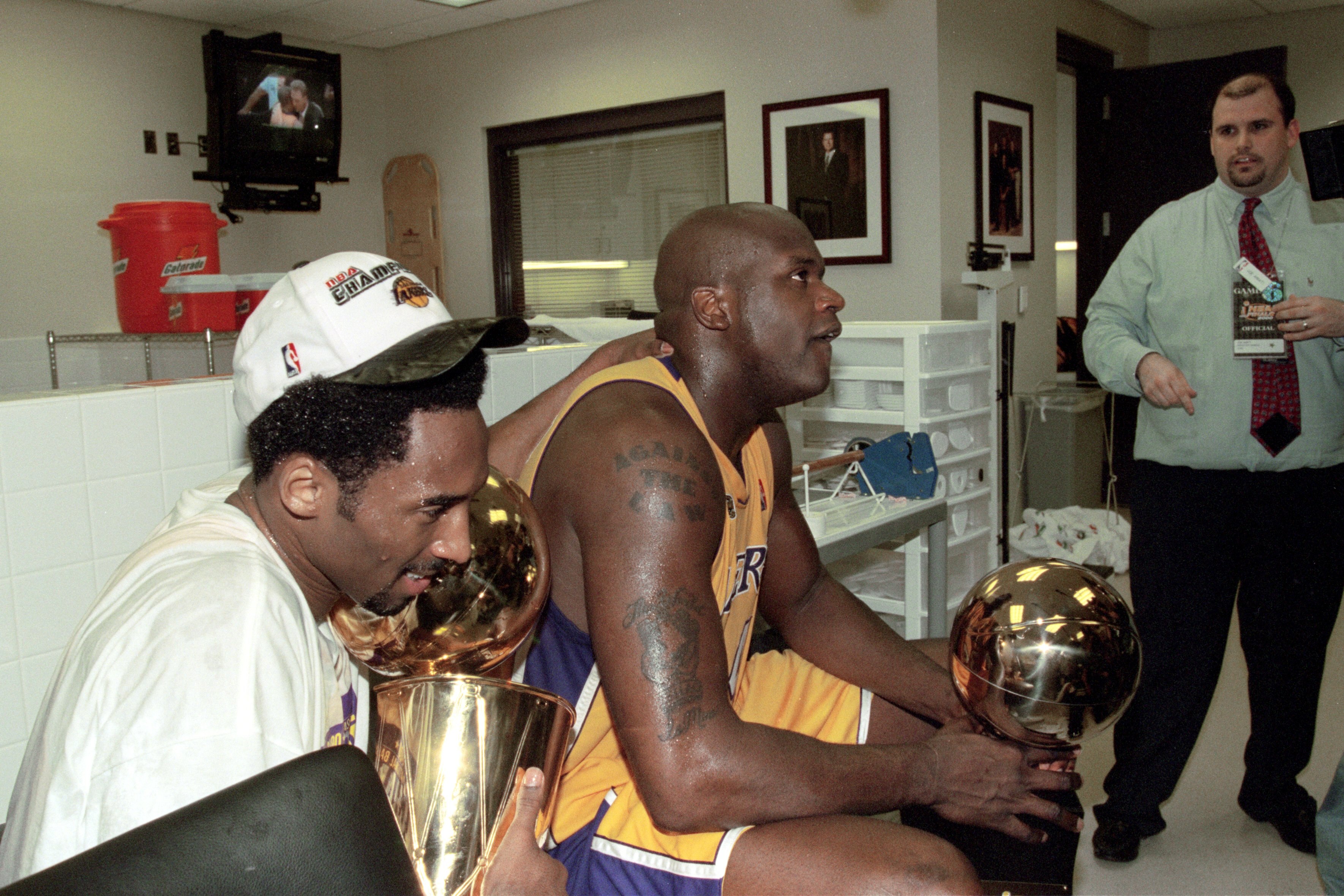 19 Jun 2000:  Kobe Bryant #8 and Shaquille O''Neal #34 of the Los Angeles Lakers hold the NBA Championship trophies after winning the NBA Finals Game 6 against the Indiana Pacers at the Staples Center in Los Angeles, California.  The Lakers defeated the P
