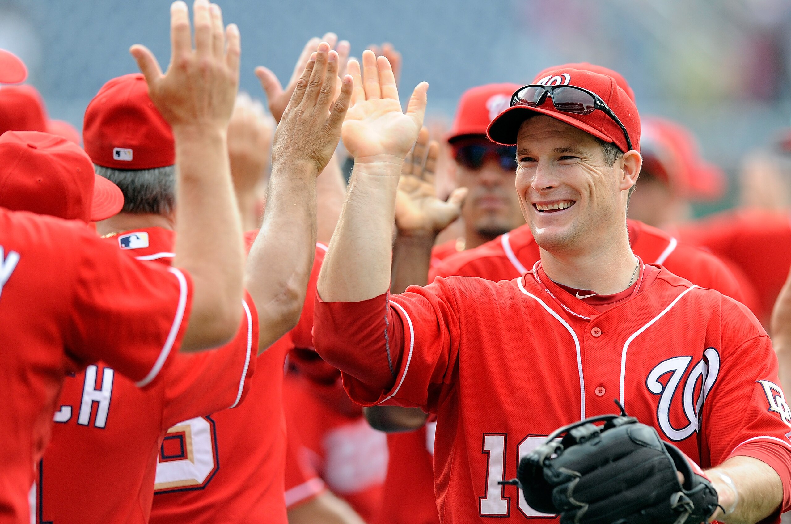 WASHINGTON - JULY 29:   Josh Willingham #16 of the Washington Nationals celebrates with teammates after a 5-3 victory against the Atlanta Braves at Nationals Park on July 29, 2010 in Washington, DC.  (Photo by Greg Fiume/Getty Images)