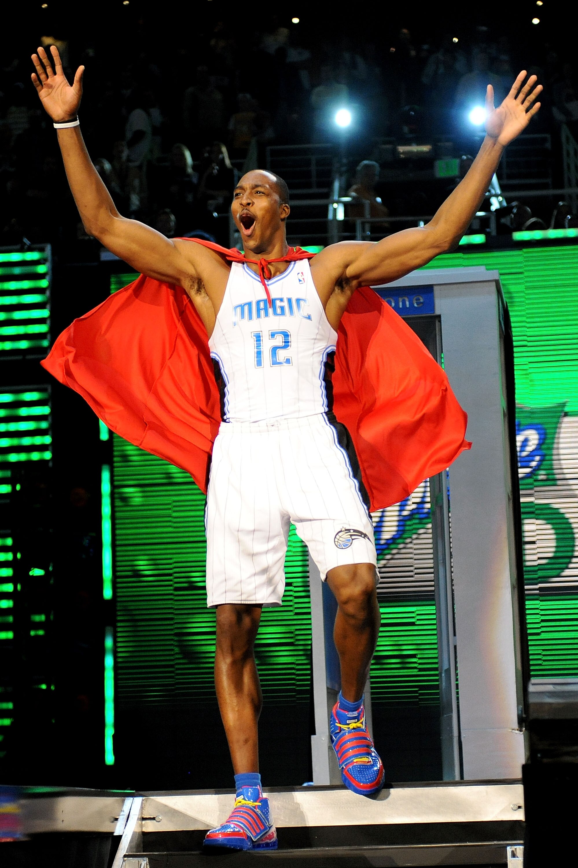 PHOENIX - FEBRUARY 14:  Dwight Howard of the Orlando Magic emerges from a phone booth wearing a Superman cape during the Sprite Slam Dunk Contest on All-Star Saturday Night, part of 2009 NBA All-Star Weekend at US Airways Center on February 14, 2009 in Ph