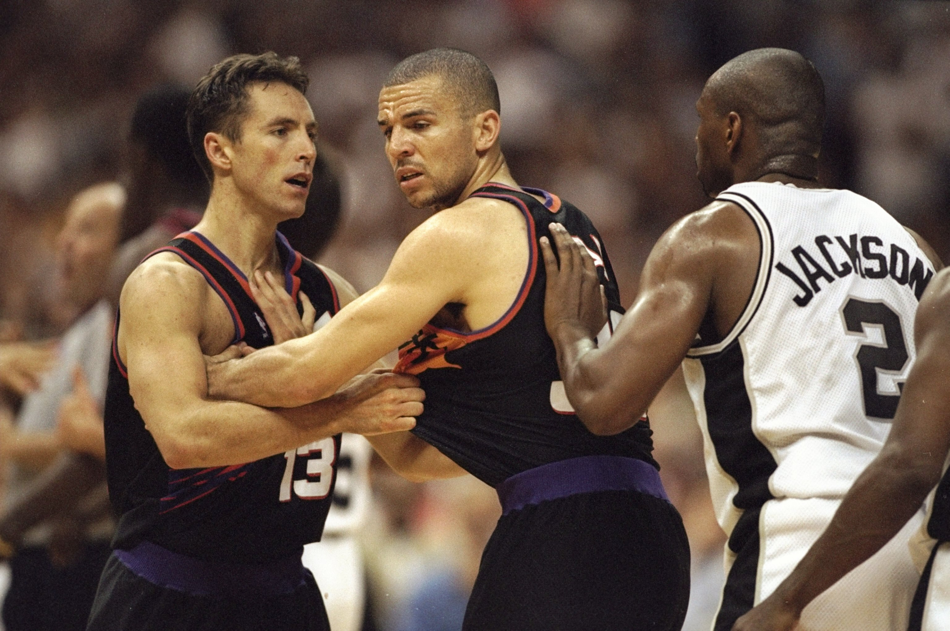 29 Apr 1998: Steve Nash #13 is held back by Jason Kidd #32 of the Phoenix Suns as Jaren Jackson #2 of the San Antonio Spurs moves in during the NBA Western Conference Playoffs round 1 game at the Alamo Dome in San Antonio, Texas. The Spurs defeated the Su