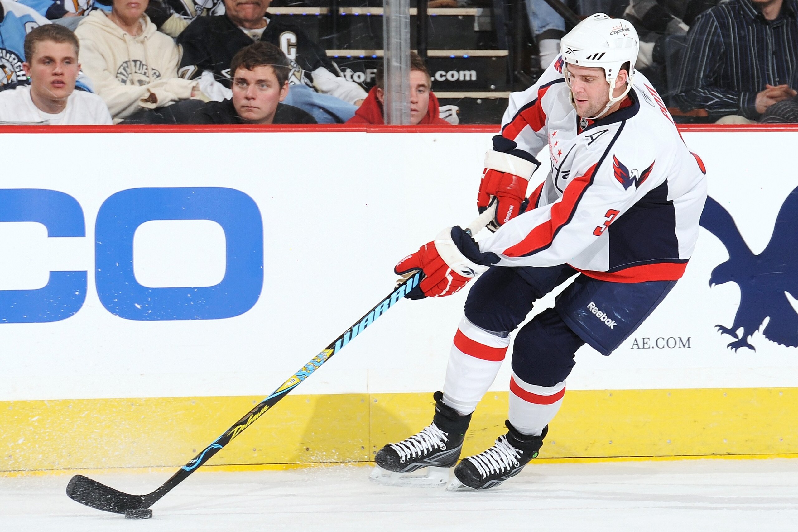 PITTSBURGH - JANUARY 21:  Defenseman Tom Poti #3 of the Washington Capitals skates with the puck against the Pittsburgh Penguins on January 21, 2010 at Mellon Arena in Pittsburgh, Pennsylvania.  (Photo by Jamie Sabau/Getty Images)