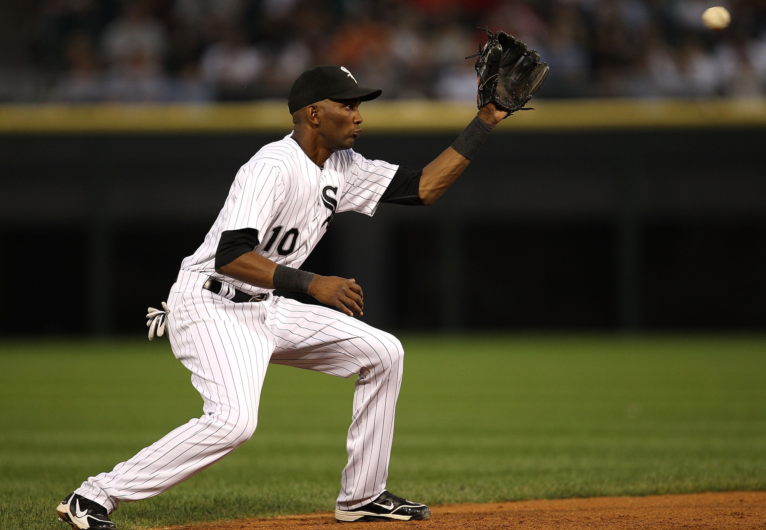 CHICAGO - AUGUST 25: Alexei Ramirez #10 of the Chicago White Sox snags a line drive hit by Josh Bell of the Baltimore Orioles at U.S. Cellular Field on August 25, 2010 in Chicago, Illinois. (Photo by Jonathan Daniel/Getty Images)
