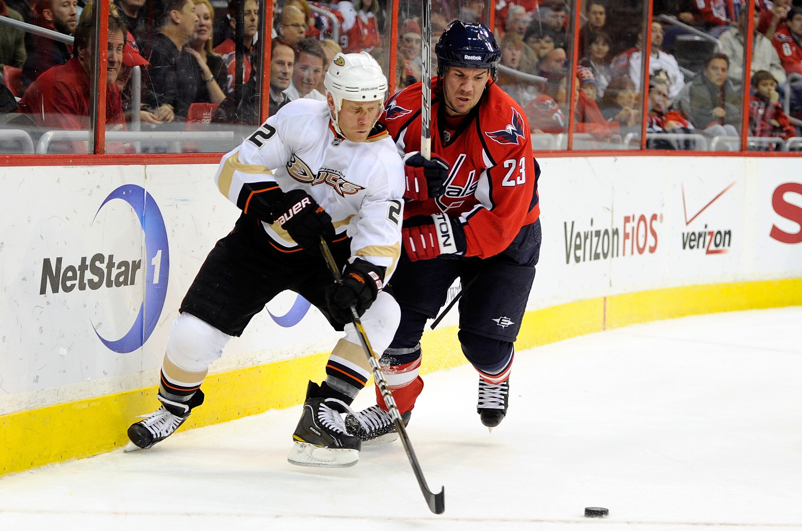 WASHINGTON, DC - DECEMBER 15:  Todd Marchant #22 of the Anaheim Ducks battles for the puck against Scott Hannan #23 of the Washington Capitals at the Verizon Center on December 15, 2010 in Washington, DC.  (Photo by Greg Fiume/Getty Images)