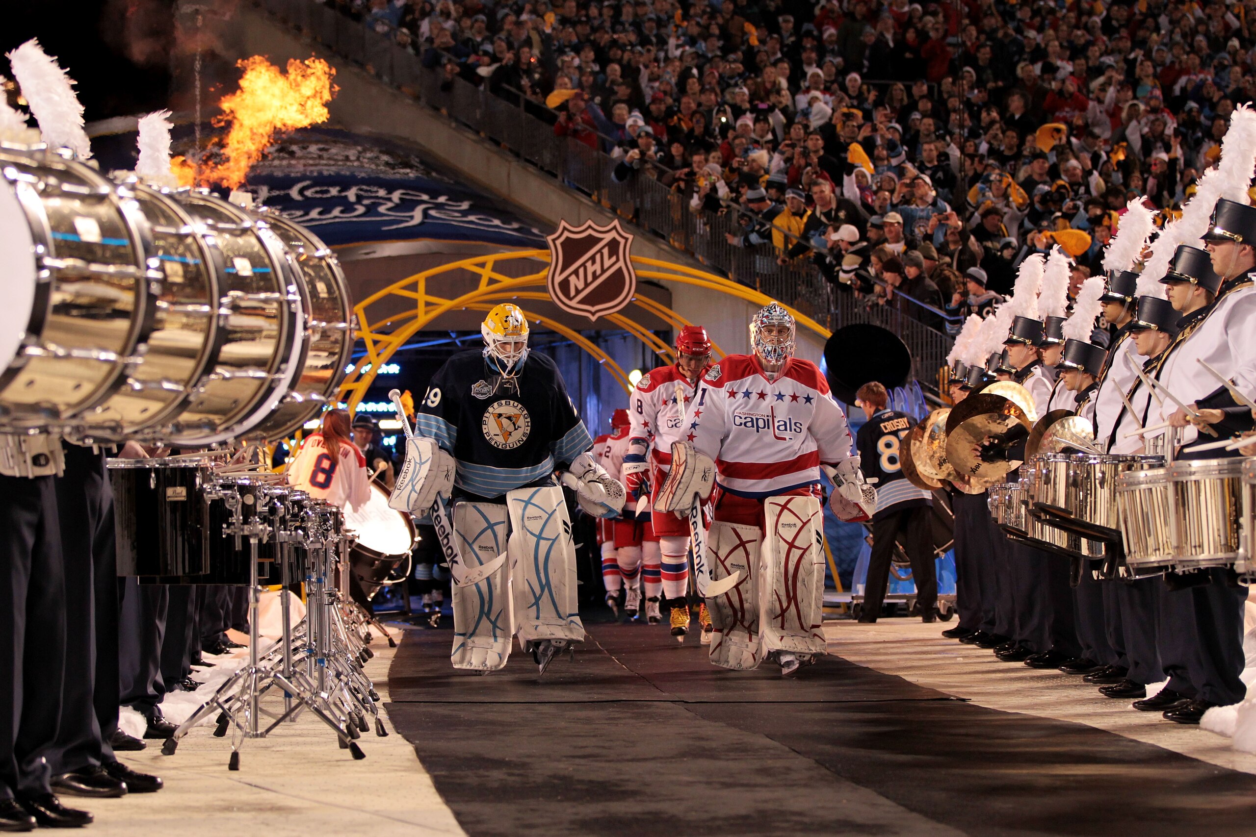 PITTSBURGH, PA - JANUARY 01:  Marc-Andre Fleury of the Pittsburgh Penguins and Semyon Varlamov #1 of the Washington Capitals walk to the ice prior to the start of the 2011 NHL Bridgestone Winter Classic at Heinz Field on January 1, 2011 in Pittsburgh, Pen