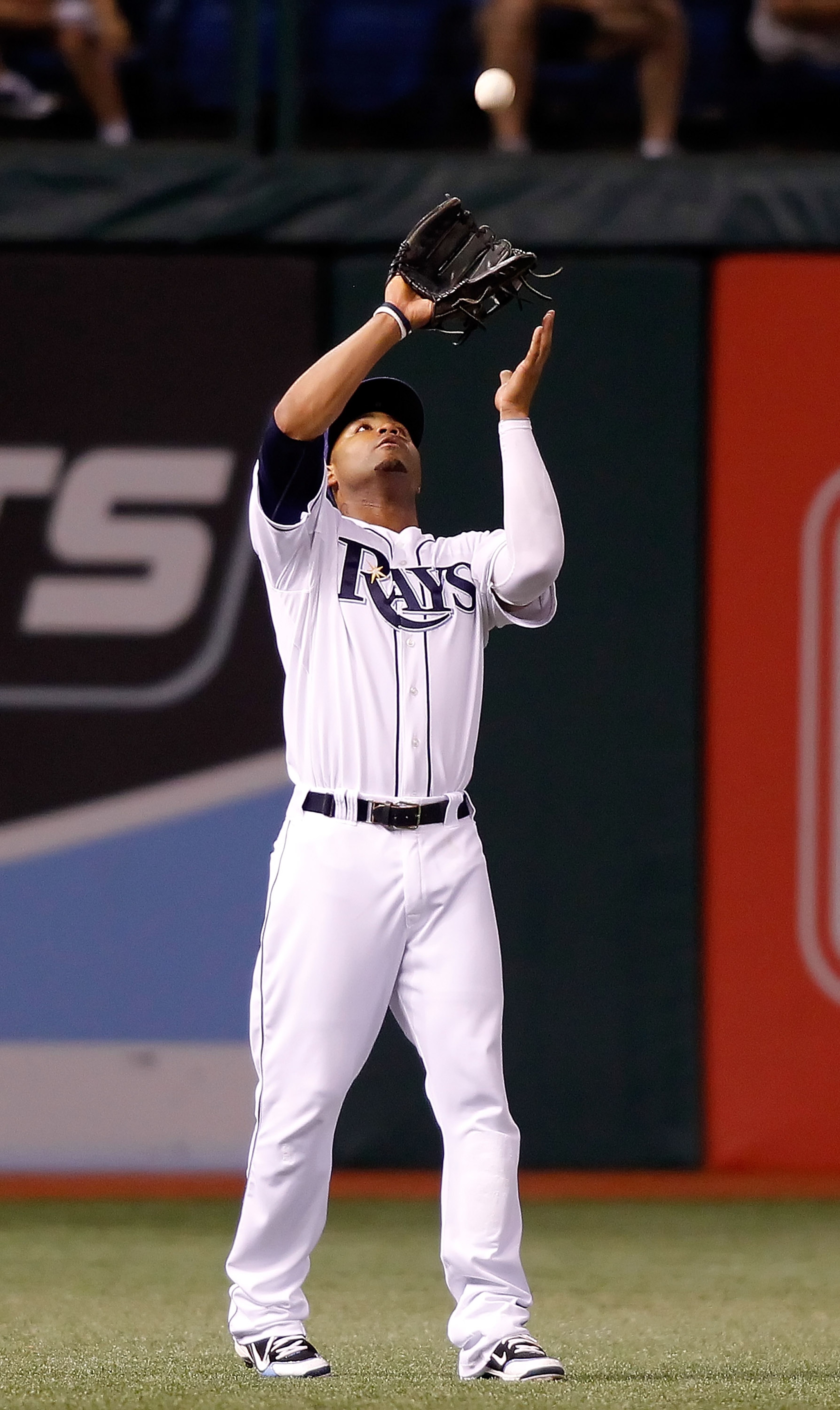ST PETERSBURG, FL - SEPTEMBER 27: Outfielder Carl Crawford #13 of the Tampa Bay Rays catches a fly ball against the Baltimore Orioles during the game at Tropicana Field on September 27, 2010 in St. Petersburg, Florida. (Photo by J. Meric/Getty Images) ST PETERSBURG, FL - SEPTEMBER 27: Outfielder Carl Crawford #13 of the Tampa Bay Rays catches a fly ball against the Baltimore Orioles during the game at Tropicana Field on September 27, 2010 in St. Petersburg, Florida. (Photo by J. Meric/Getty Images)