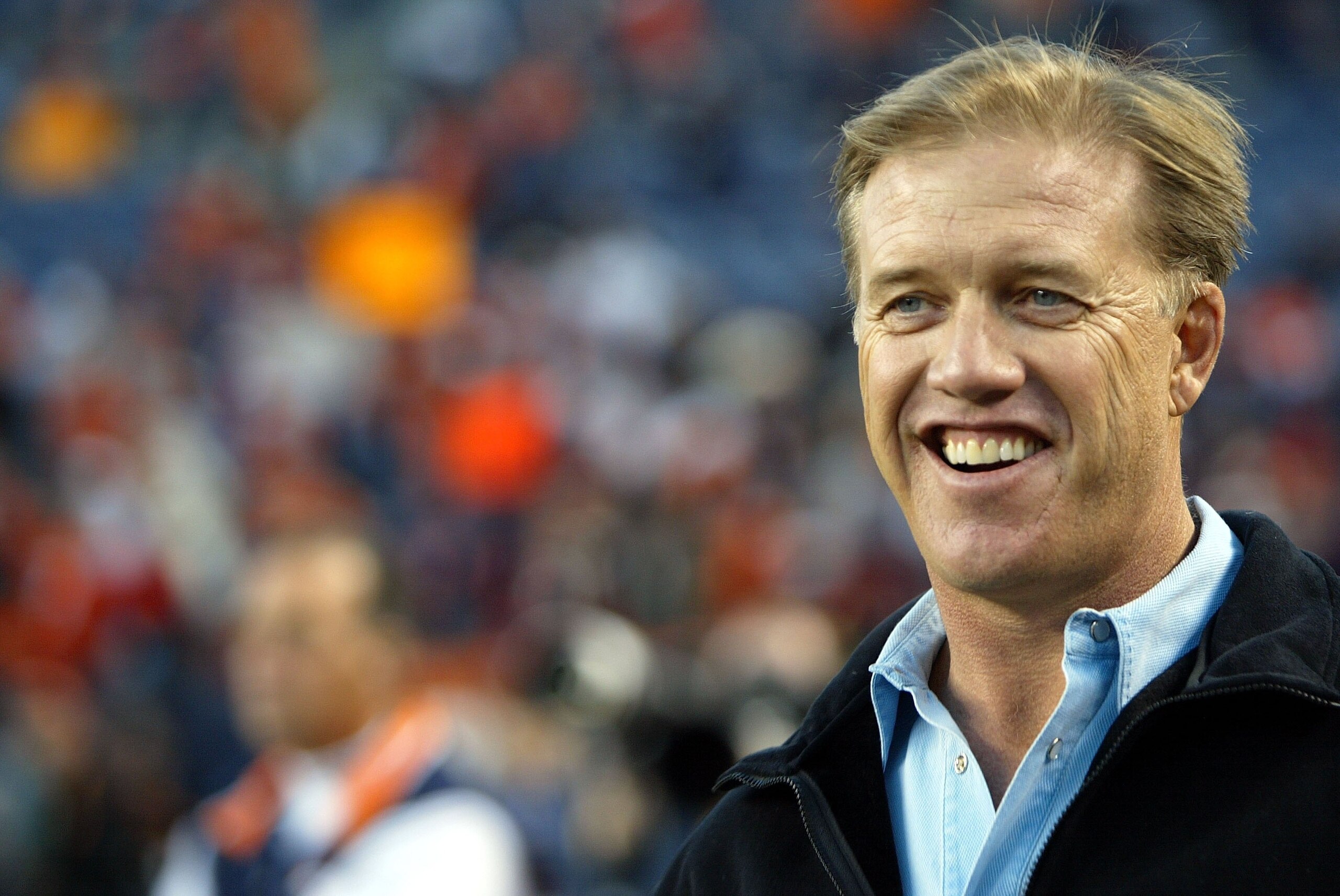 DENVER - JANUARY 14:  Former Denver Broncos quarterback John Elway stands on the field before a Divisional Playoff game against the New England Patriots on January 14, 2006 at Invesco Field at Mile High in Denver, Colorado.  (Photo by Doug Pensinger/Getty