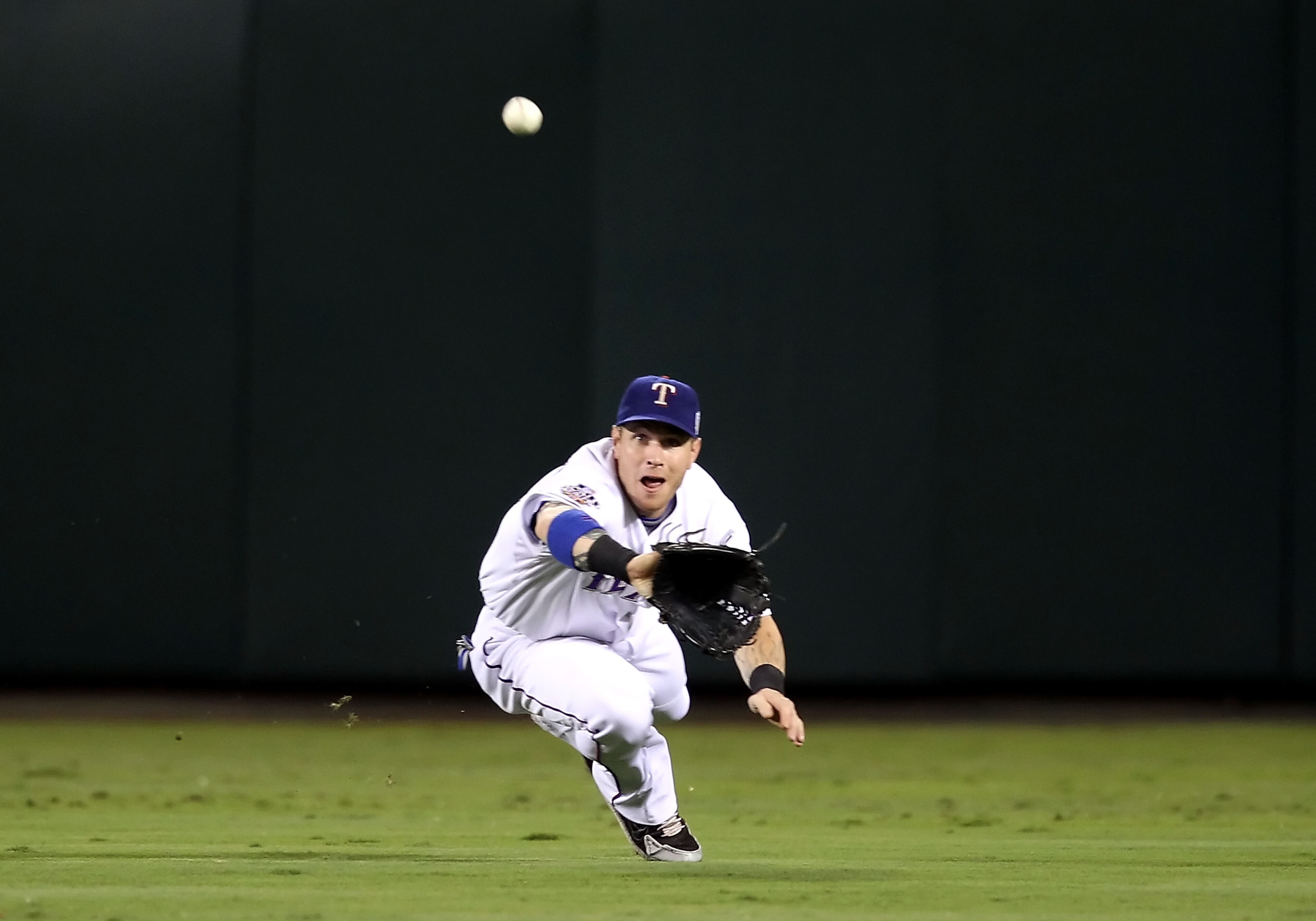 ARLINGTON, TX - OCTOBER 31: Josh Hamilton #32 of the Texas Rangers makes a diving catch in the second inning against the San Francisco Giants in Game Four of the 2010 MLB World Series at Rangers Ballpark in Arlington on October 31, 2010 in Arlington, Tex ARLINGTON, TX - OCTOBER 31: Josh Hamilton #32 of the Texas Rangers makes a diving catch in the second inning against the San Francisco Giants in Game Four of the 2010 MLB World Series at Rangers Ballpark in Arlington on October 31, 2010 in Arlington, Tex