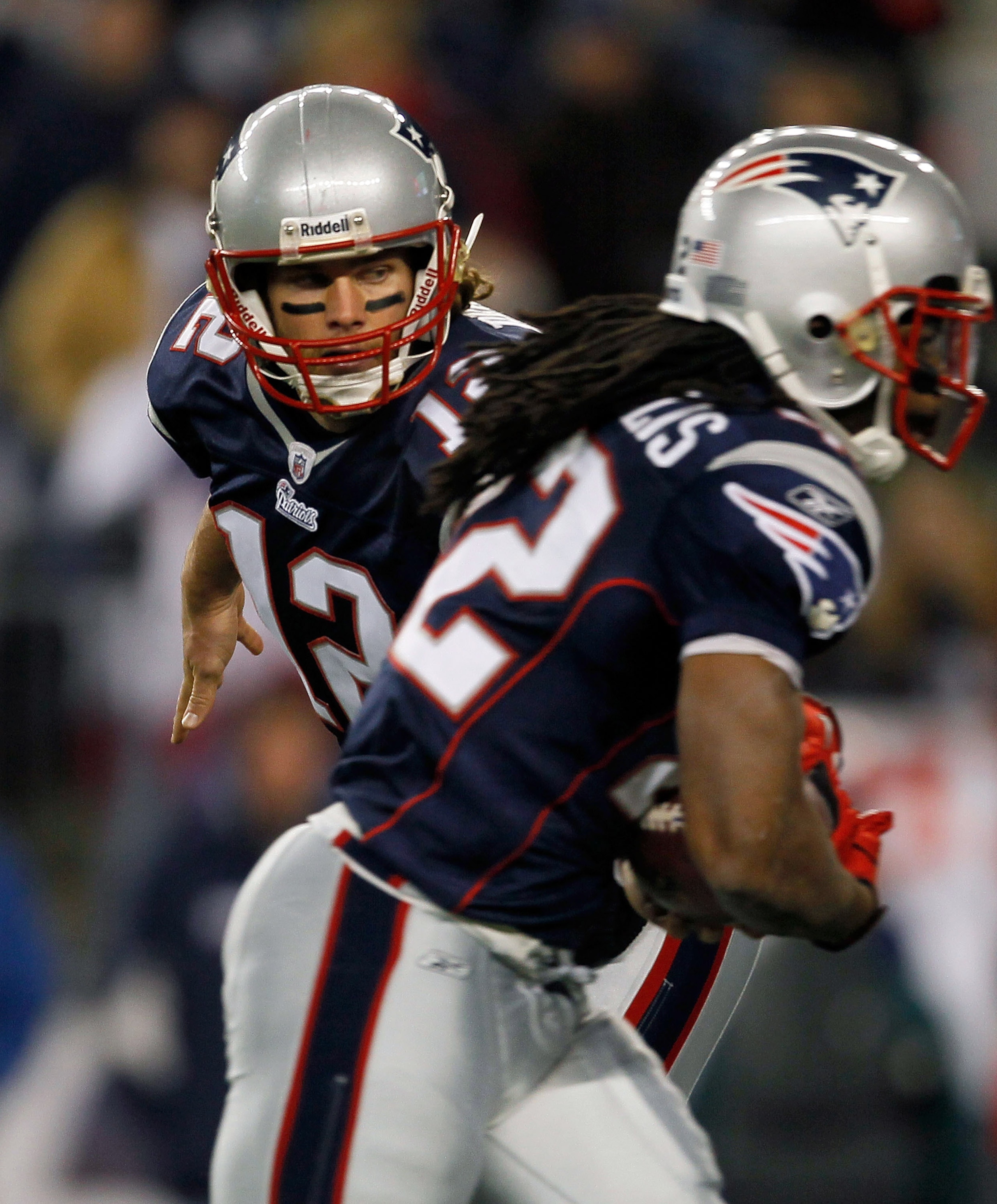 FOXBORO, MA - NOVEMBER 21: Tom Brady #12 of the New England Patriots hands the ball to terammate BenJarvis Green-Ellis, who  runs the ball in for a touchdown in the second half at Gillette Stadium on November 21, 2010 in Foxboro, Massachusetts. (Photo by